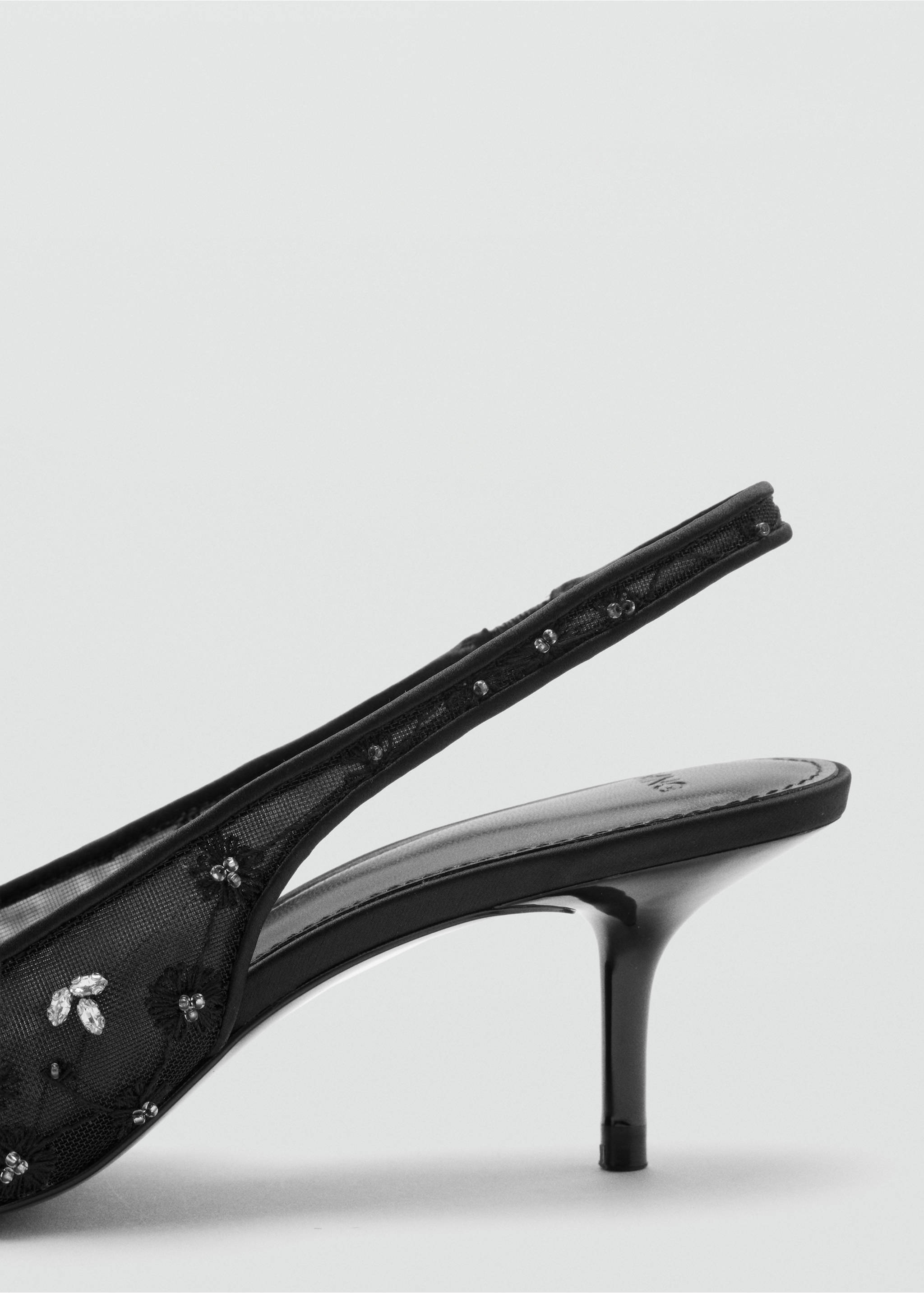 Close-up of a black mesh slingback shoe with crystal embellishments and a kitten heel., Black. Ref: 37078278-00.