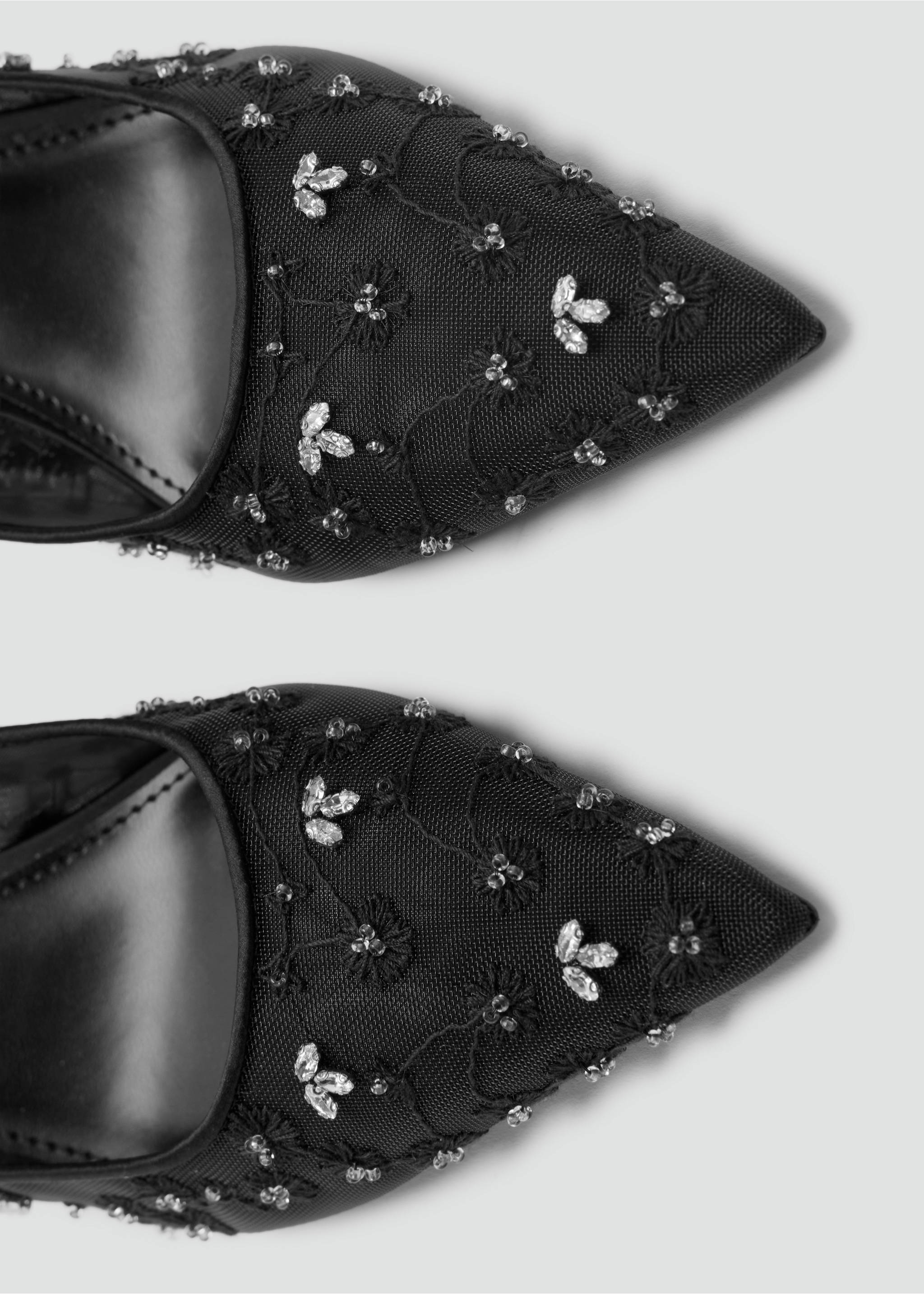 Close-up of black mesh shoes with pointed toes and crystal floral beading., Black. Ref: 37078278-00.