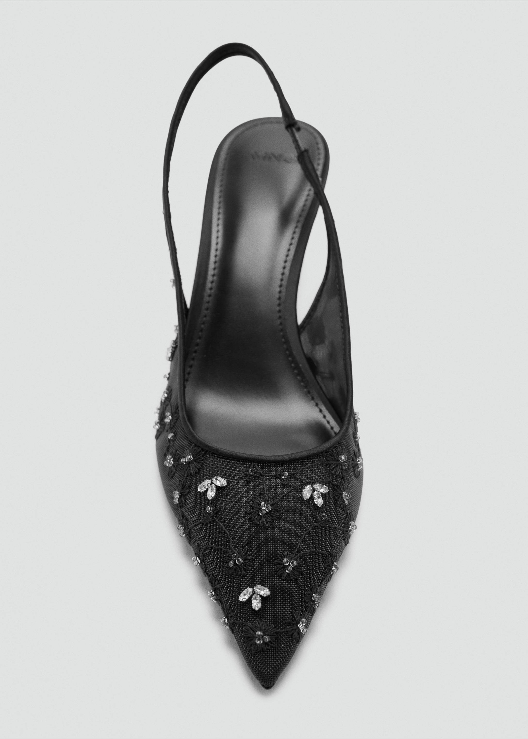 Black slingback shoe with pointed toe, sheer mesh upper, embroidery, and crystal embellishments., Black. Ref: 37078278-00.