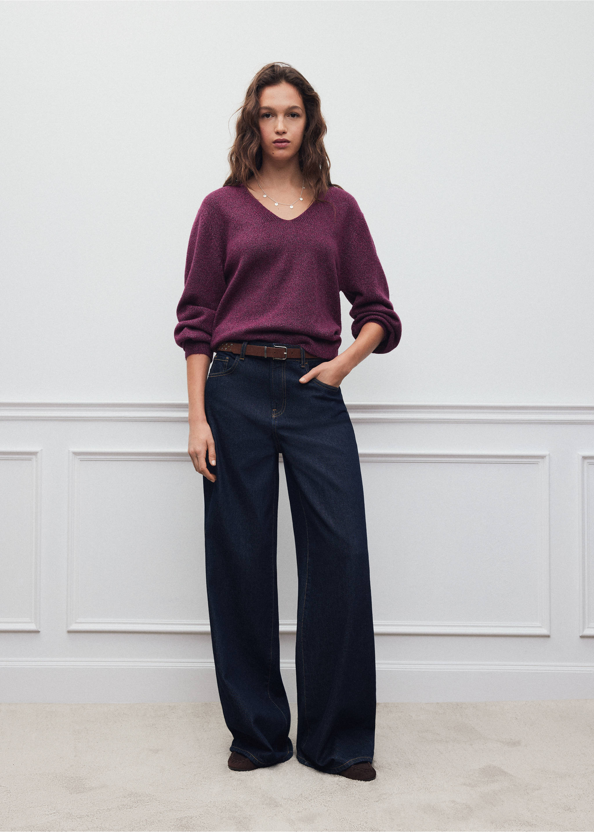 Plum purple V-neck jersey sweater worn with dark blue wide-leg trousers., Fuchsia. Ref: 37078280-00.