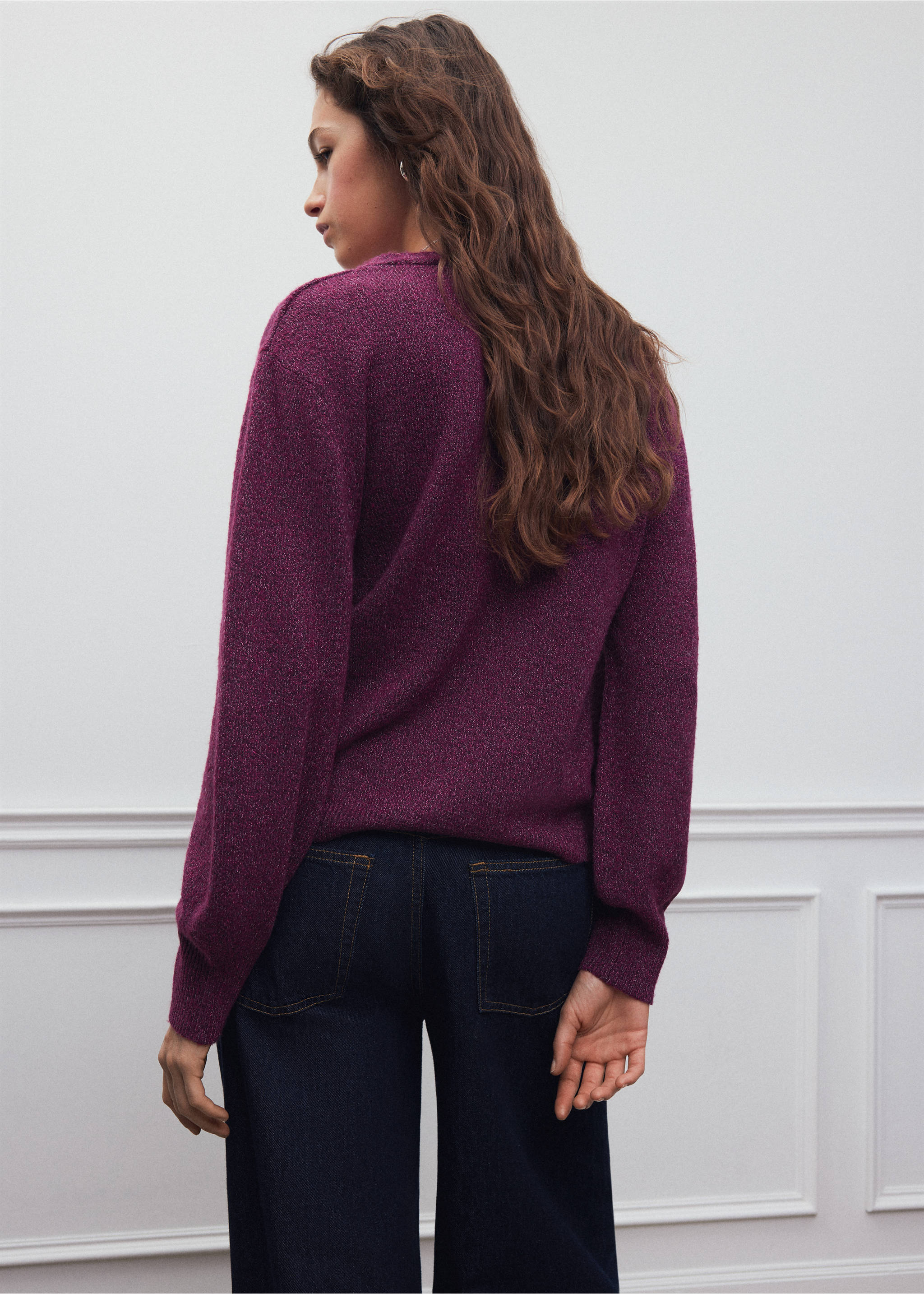 Back view of a purple knit jersey with long sleeves, worn with dark blue trousers., Fuchsia. Ref: 37078280-00.