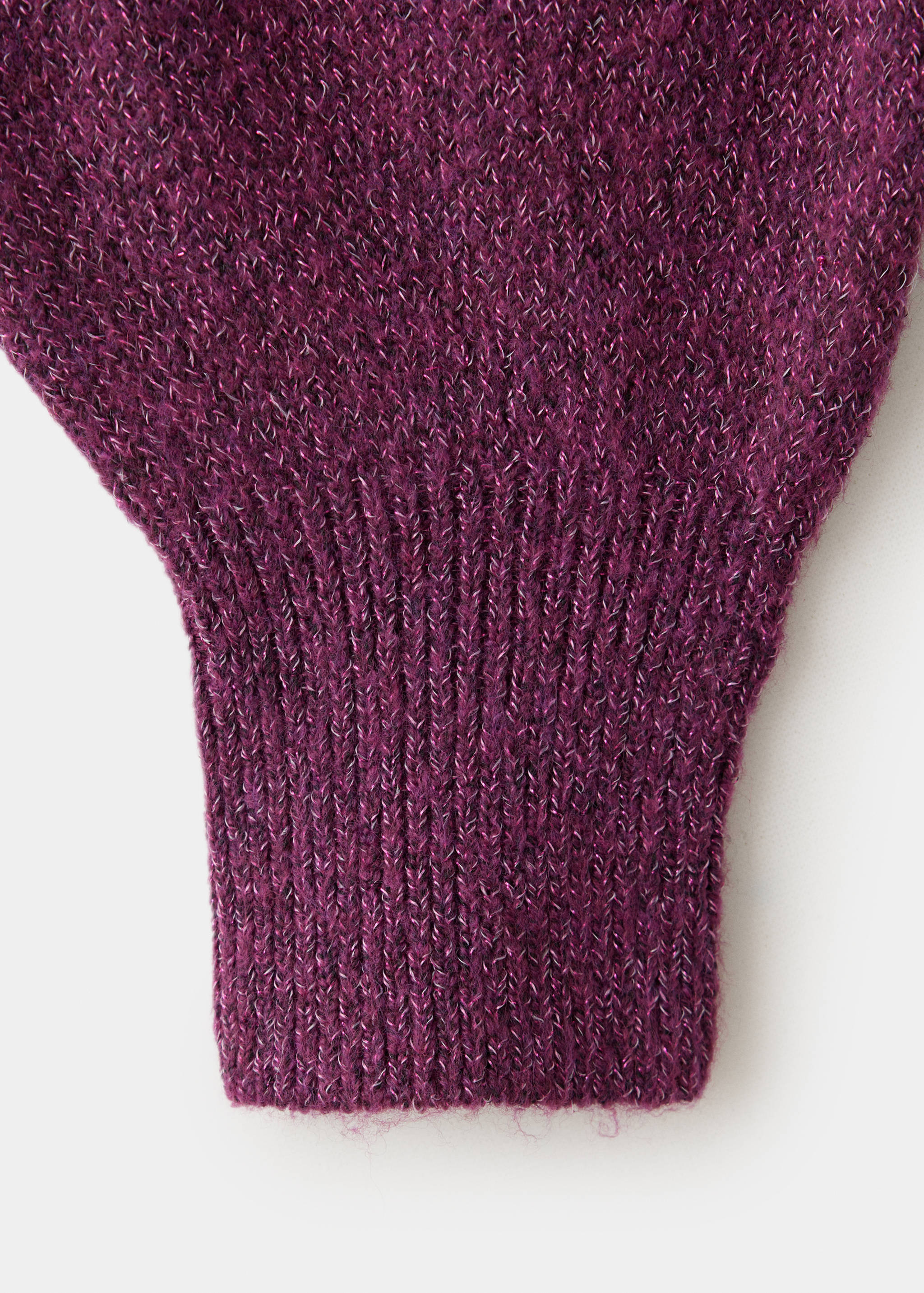 Close-up of the purple knit jersey texture, showing the ribbed cuff.