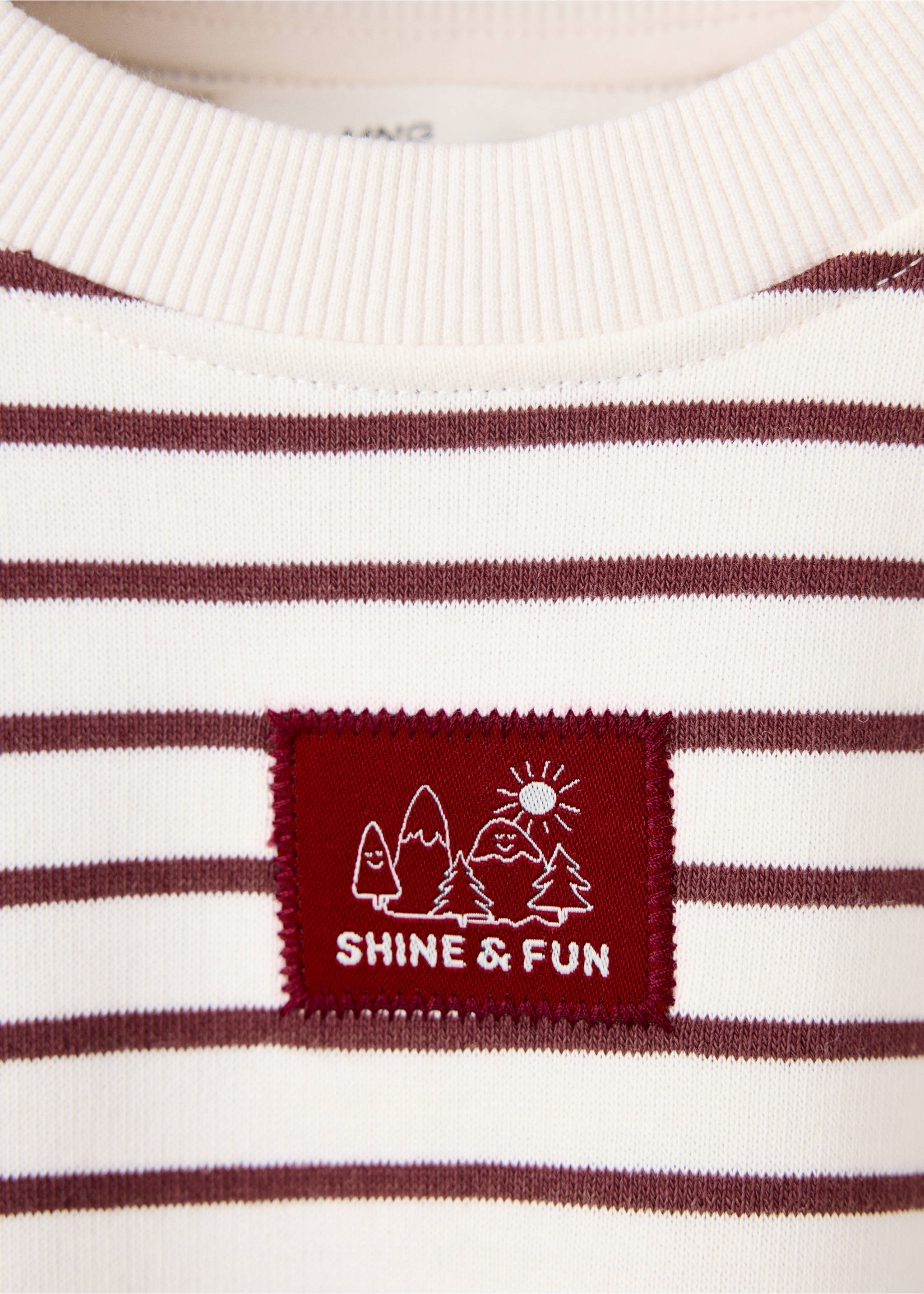 Close-up of a striped kids' sweatshirt with a branded chest patch., Ecru. Ref: 37078281-00.