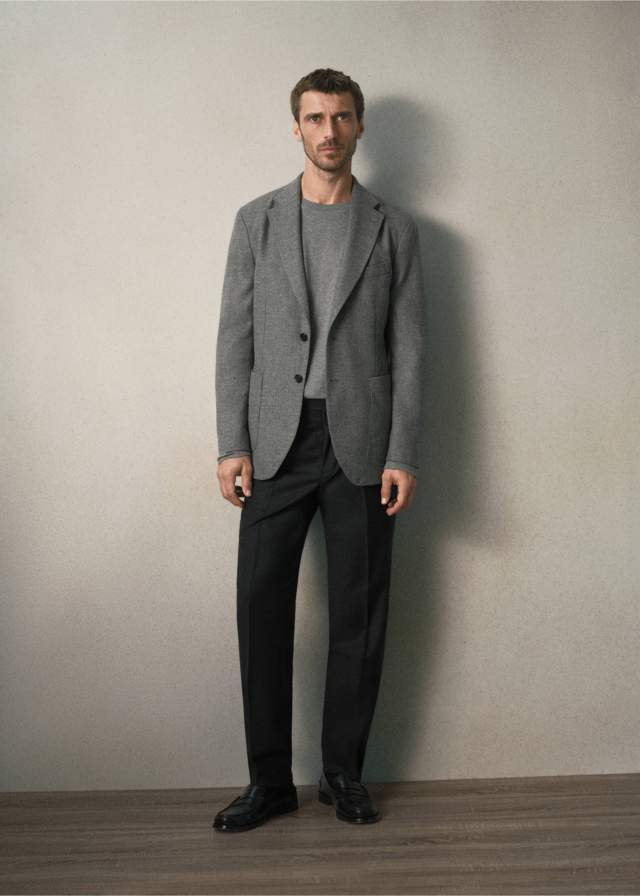 Grey textured blazer worn with a grey sweater and dark trousers, Light Heather Grey. Ref: 37078283-00.