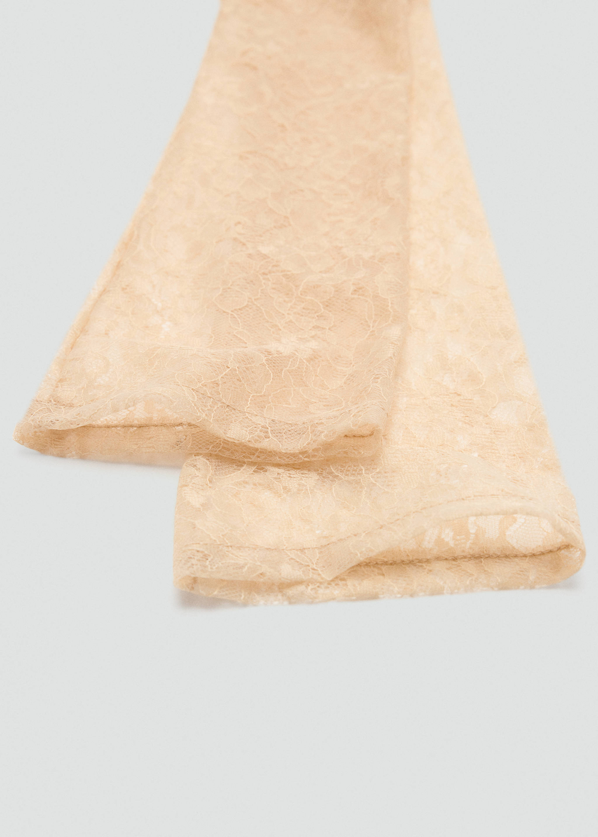 Long beige lace gloves with a delicate floral pattern.