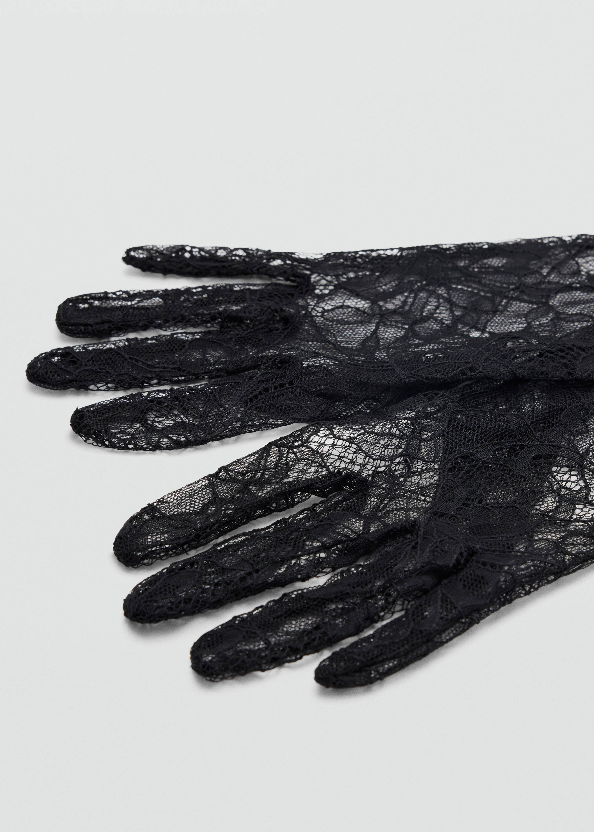 Black lace gloves in a delicate floral pattern.