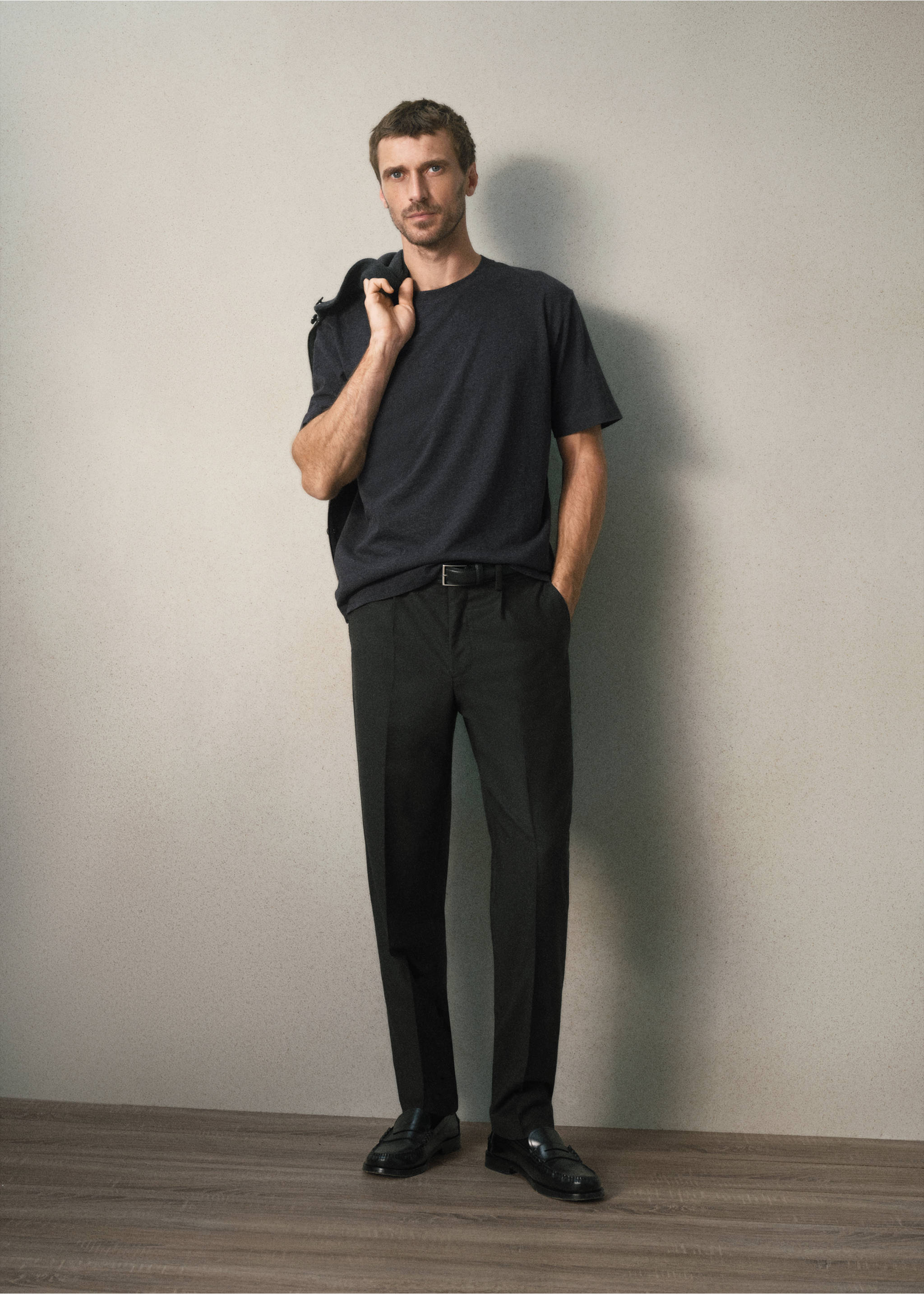 Dark grey short-sleeved t-shirt with a crew neckline worn with trousers., Charcoal. Ref: 37078635-00.