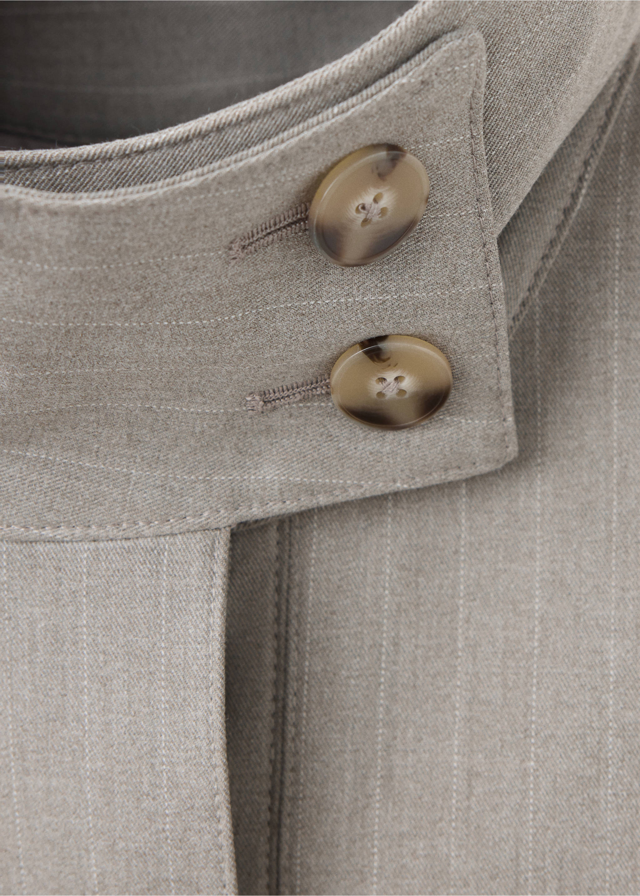 Close-up of a grey pinstripe jacket collar with marbled buttons., Medium Brown. Ref: 37078639-00.