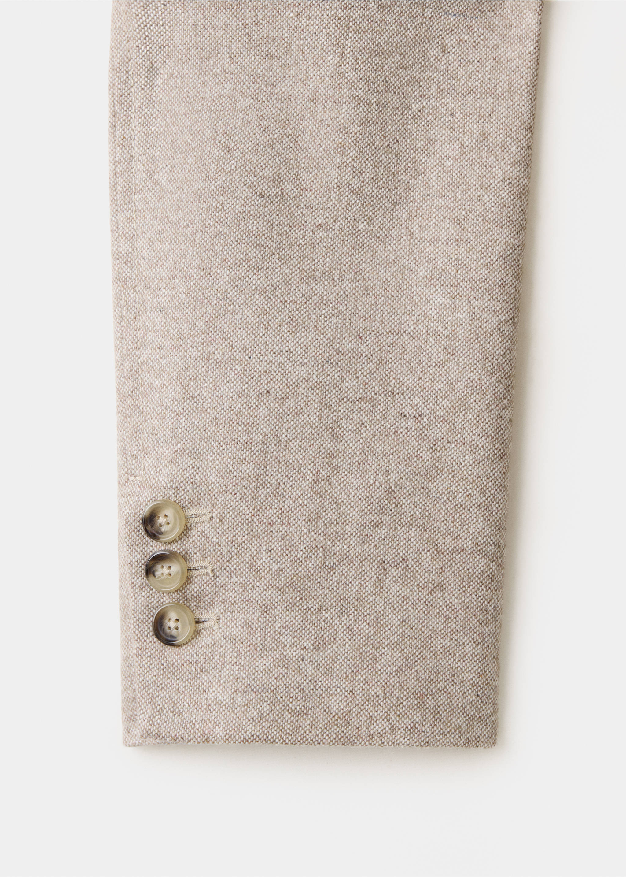 Close-up of a beige textured blazer sleeve with three tortoiseshell buttons., Beige. Ref: 37078640-00.