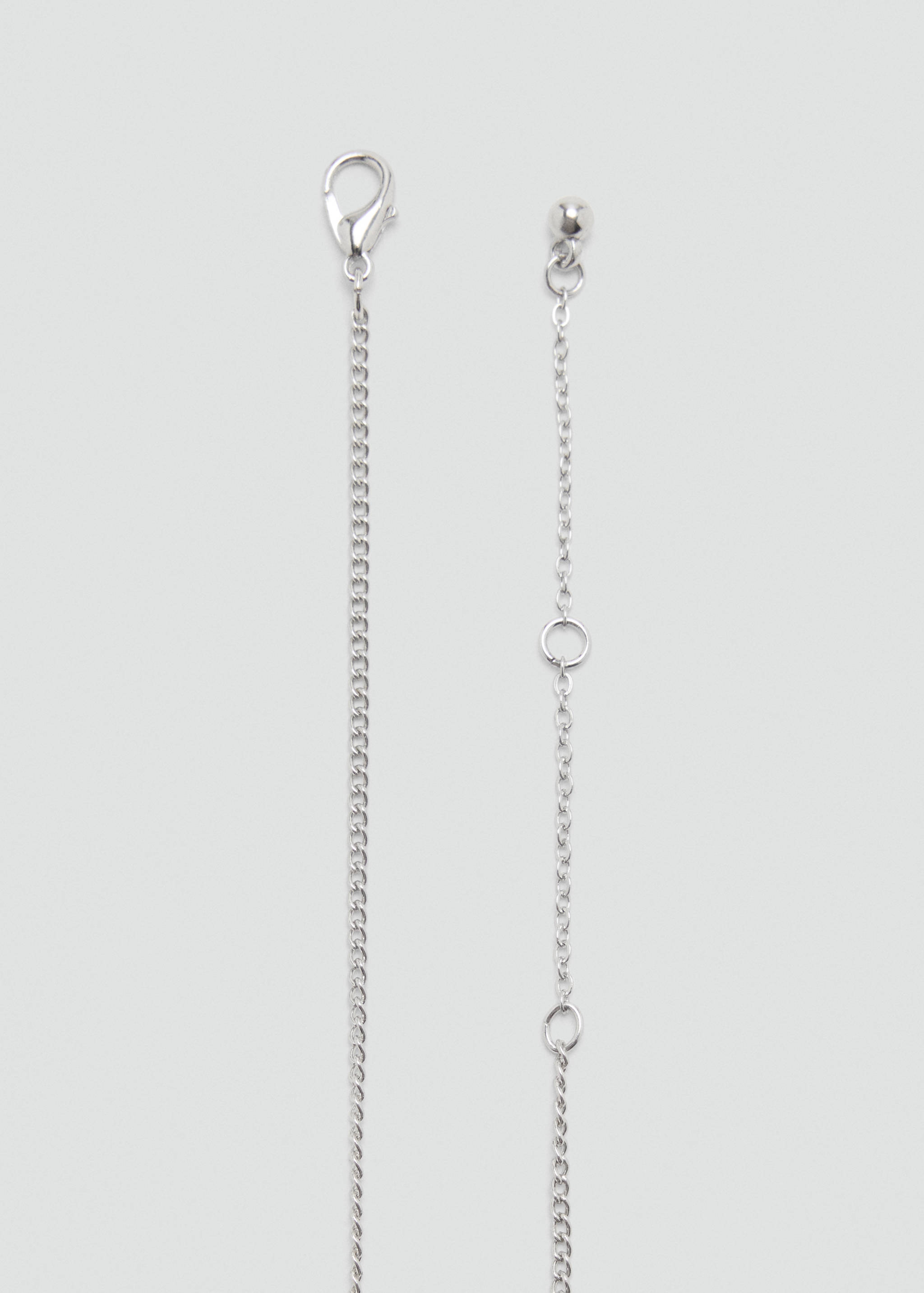 Silver-toned chain belt detail showing lobster clasp and adjustable link end