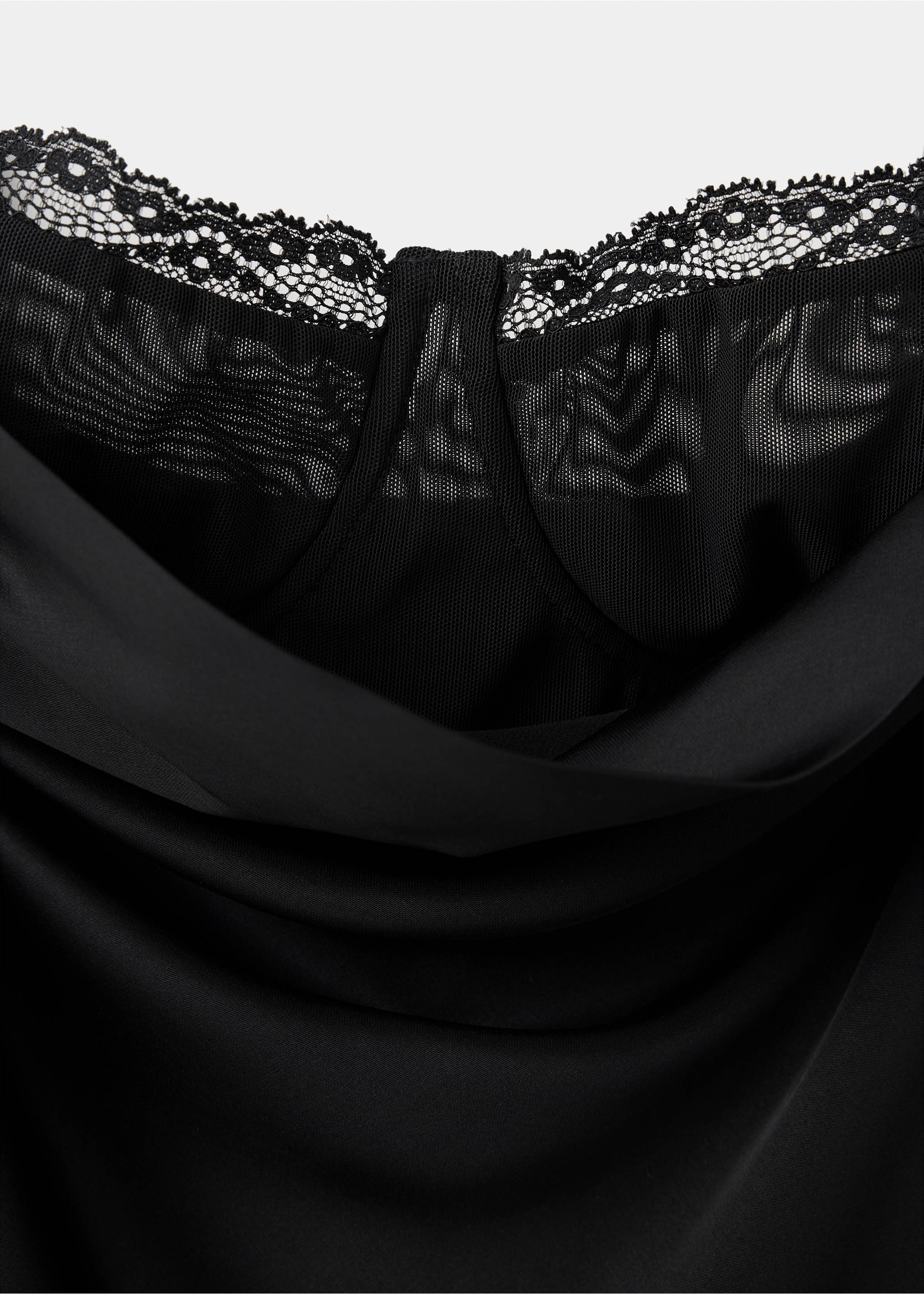 Close-up of a black dress with a cowl neck, sheer mesh insert, and lace trim., Black. Ref: 37079142-00.