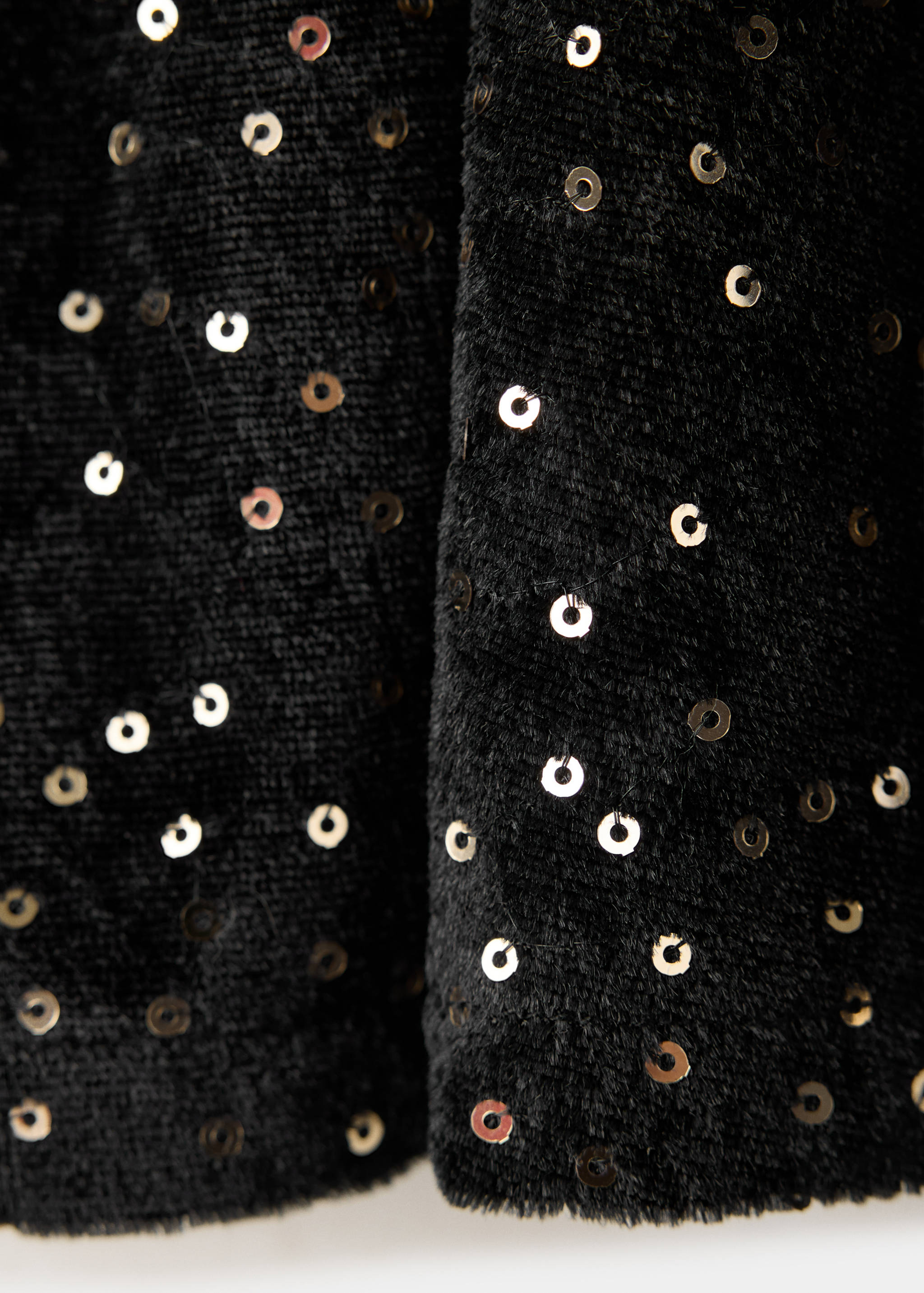 Black sequin skirt fabric detail