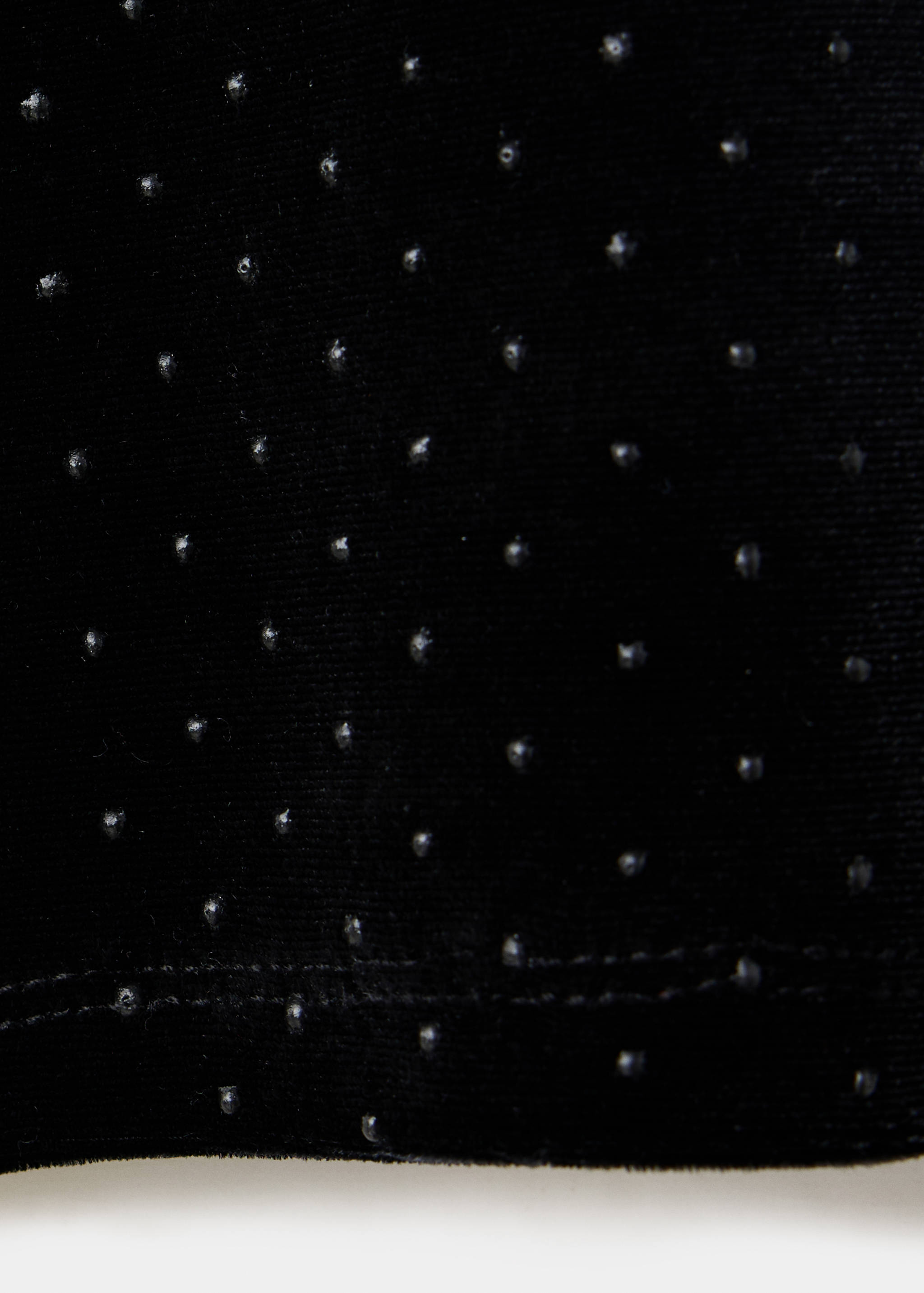 Black velvet t-shirt fabric detail with tiny glittering studs.