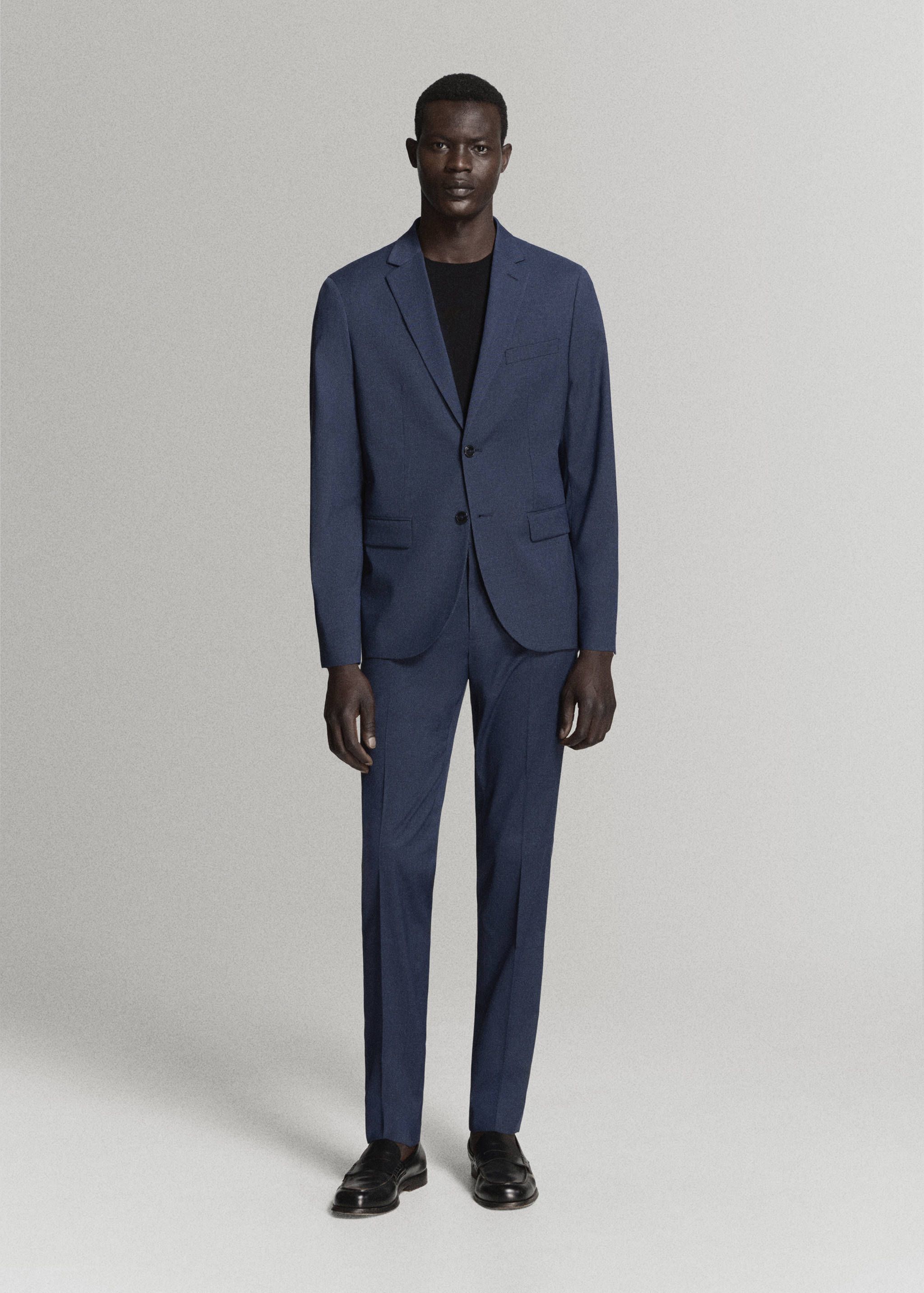 Blue suit trousers with a straight-leg fit and pressed creases.