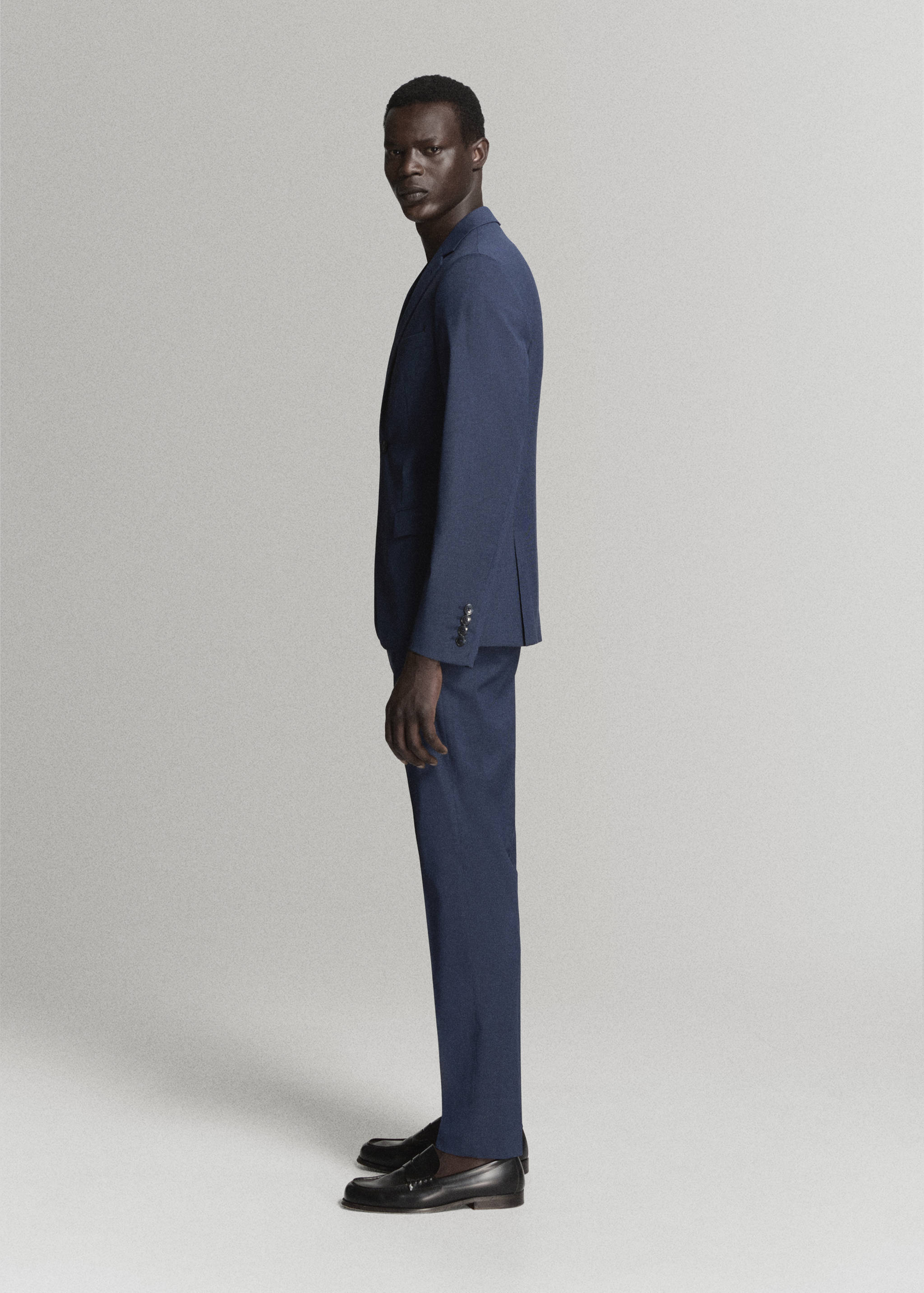 Blue suit trousers with a slim-fit silhouette.