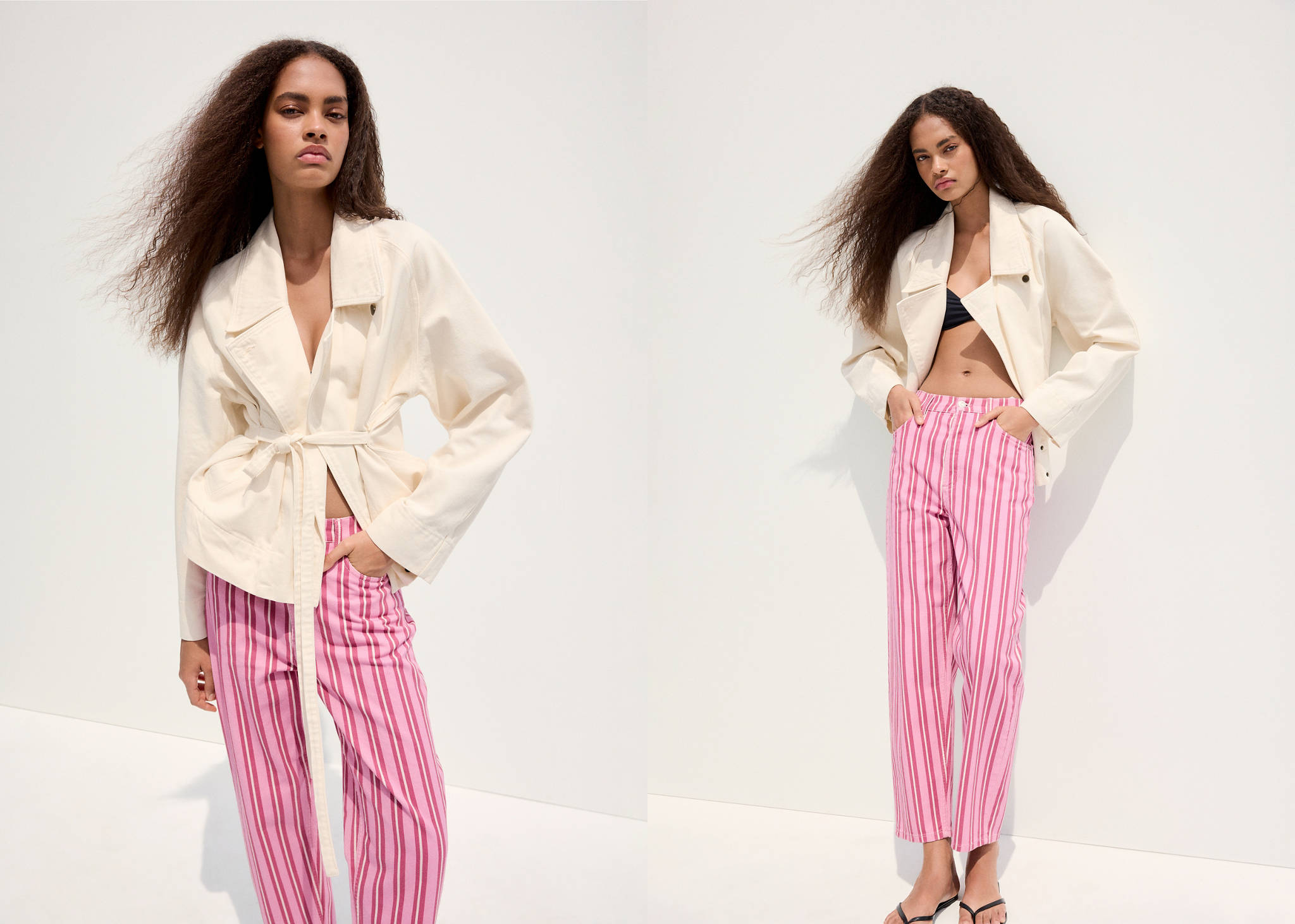 Model wearing a cream denim jacket and pink striped trousers.