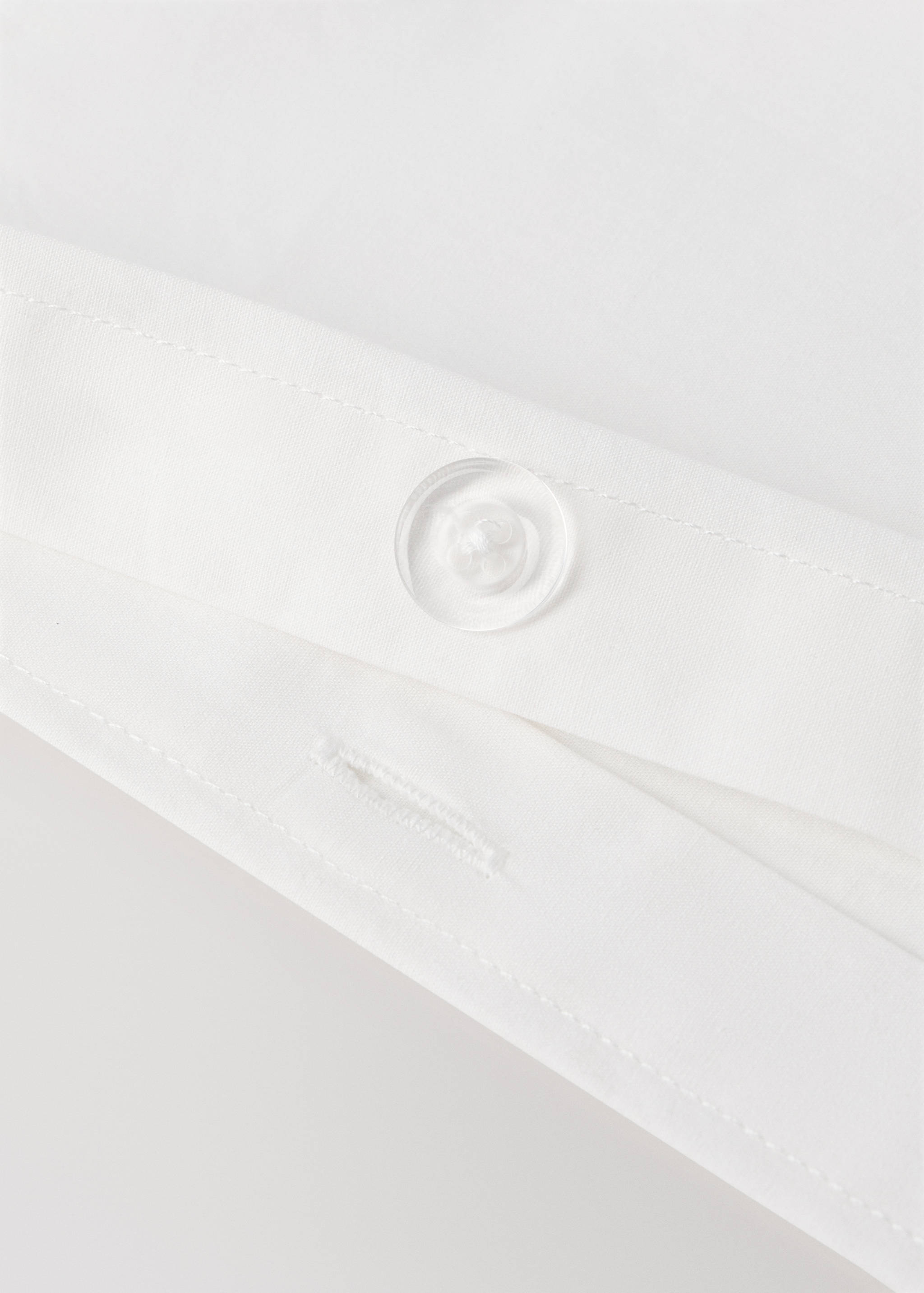 White duvet cover button detail.