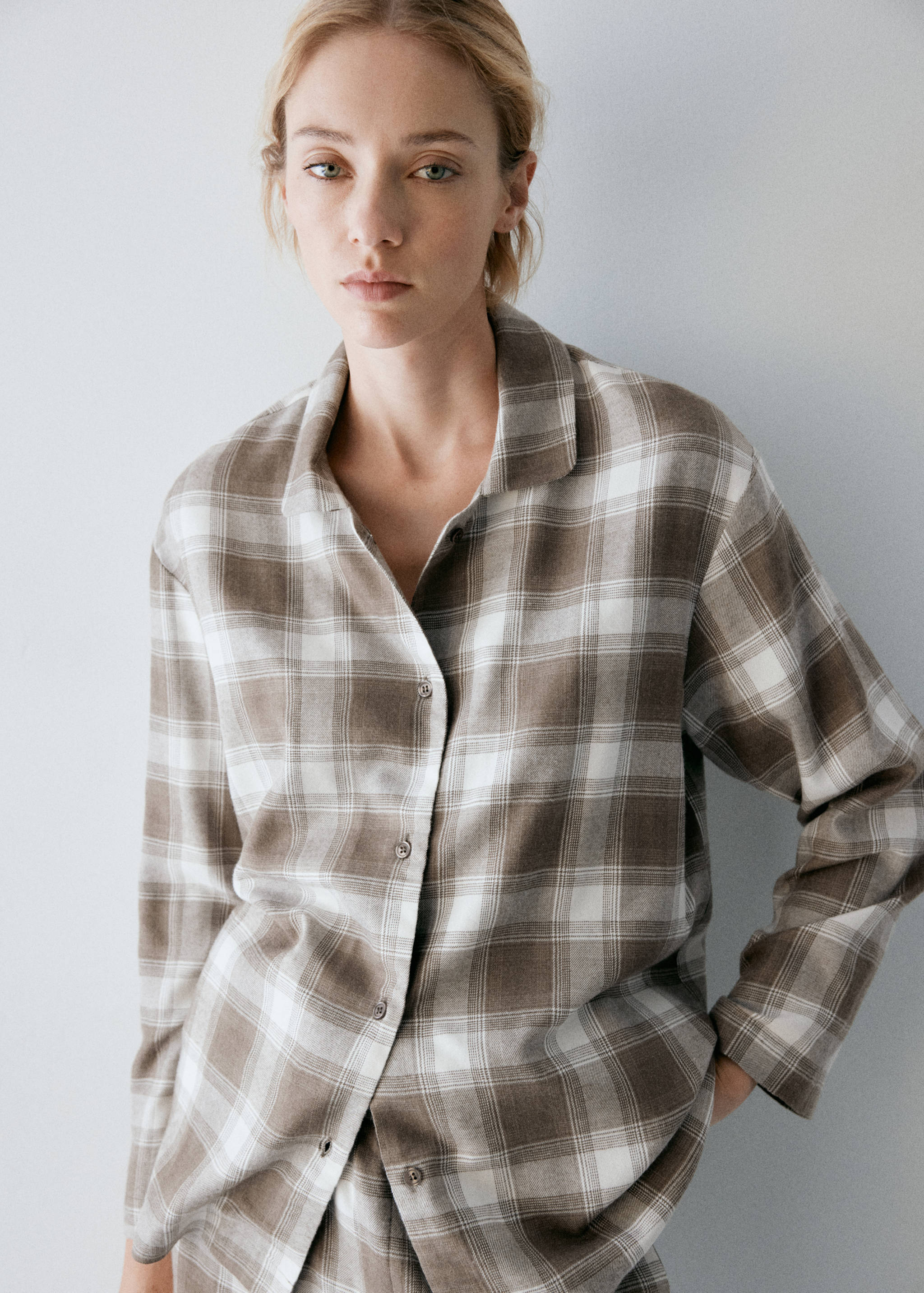 Brown and white plaid pyjama shirt with a lapel collar and buttons.