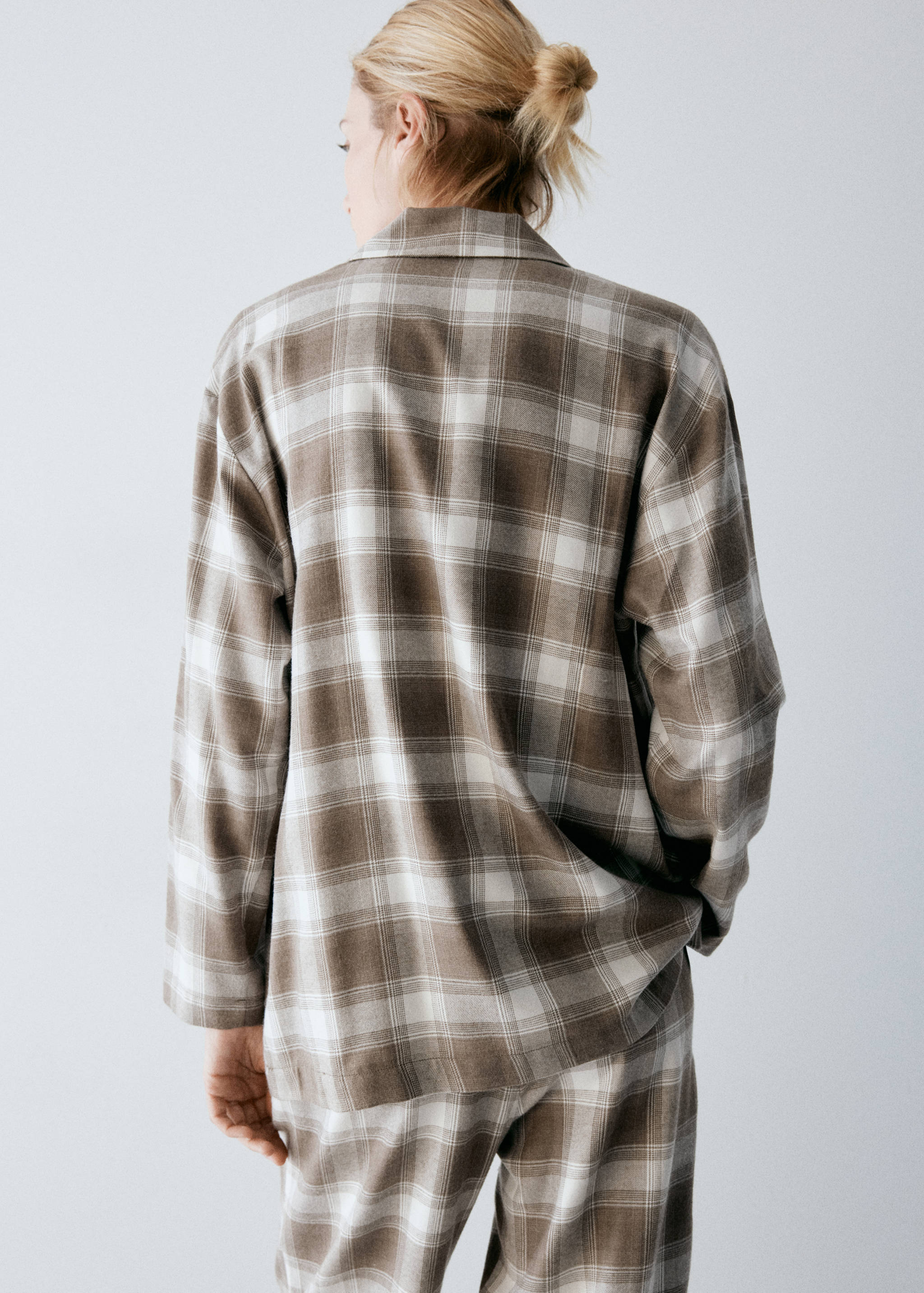 Brown and white plaid pyjama shirt with long sleeves and lapel collar, back view.