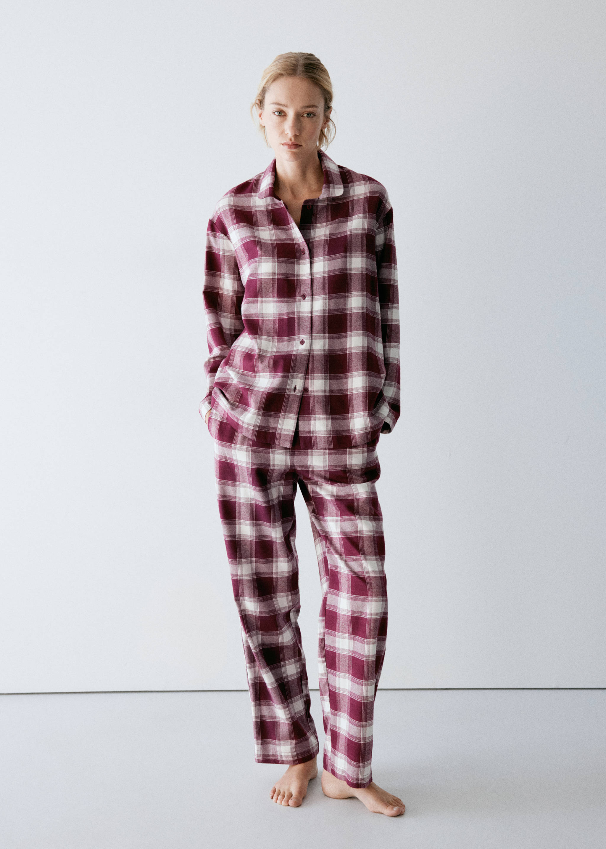 Burgundy and white check pyjama top with long sleeves and collar.