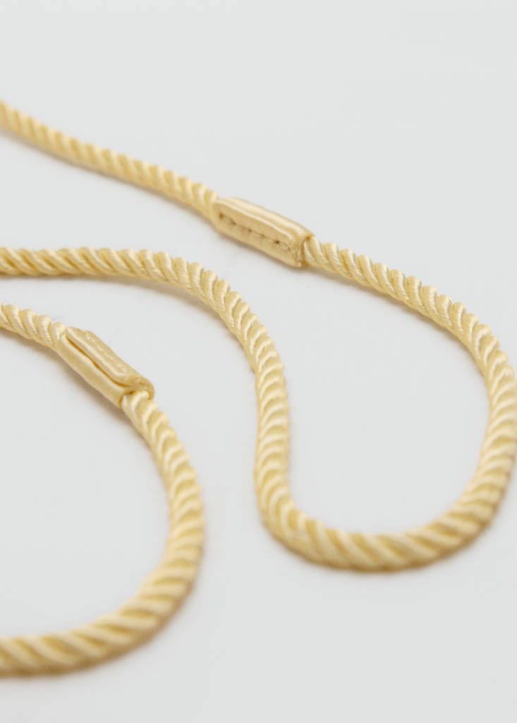 Satin clutch bag with tassels — Pastel Yellow