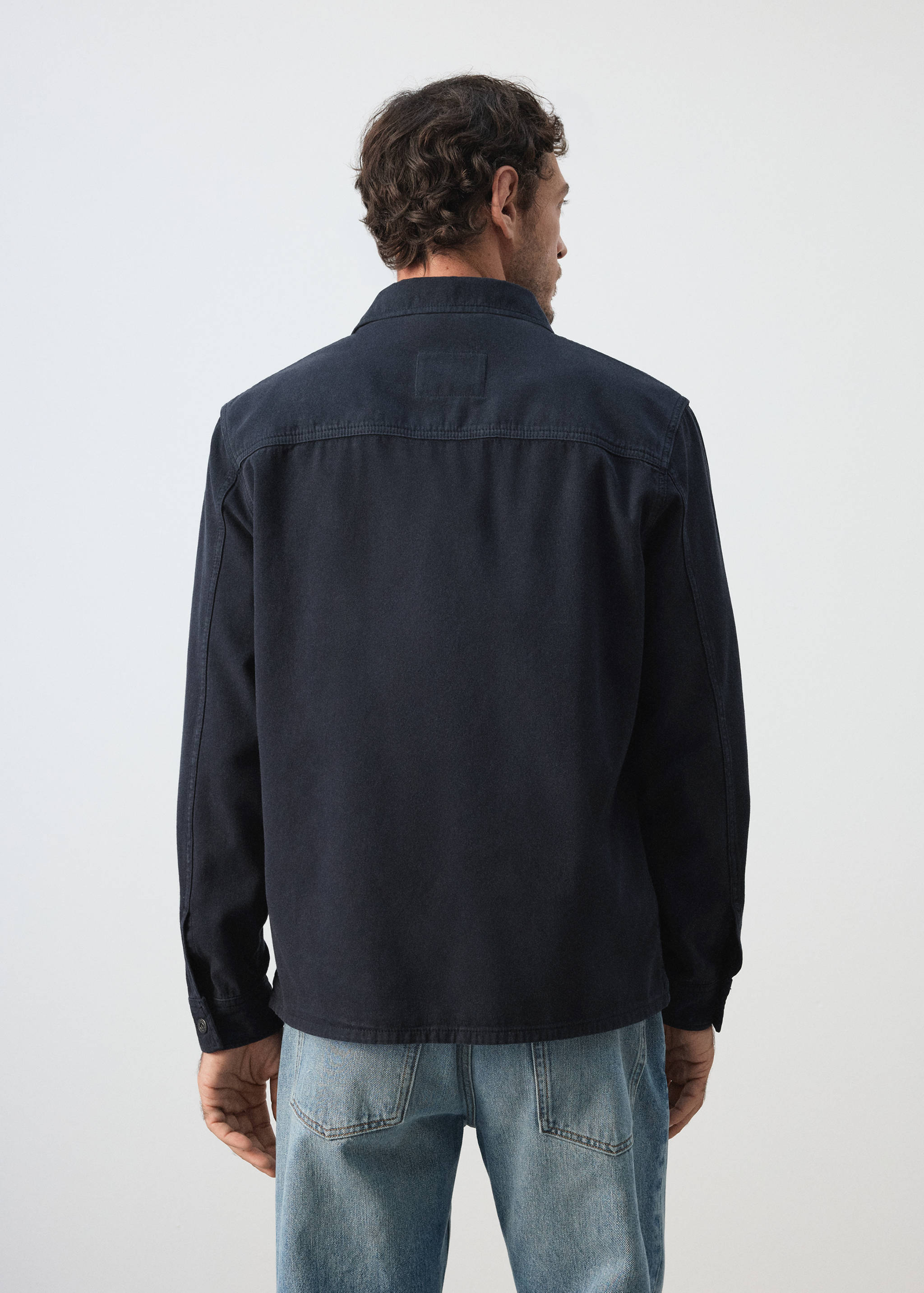 Denim overshirt pockets - Reverse of the article