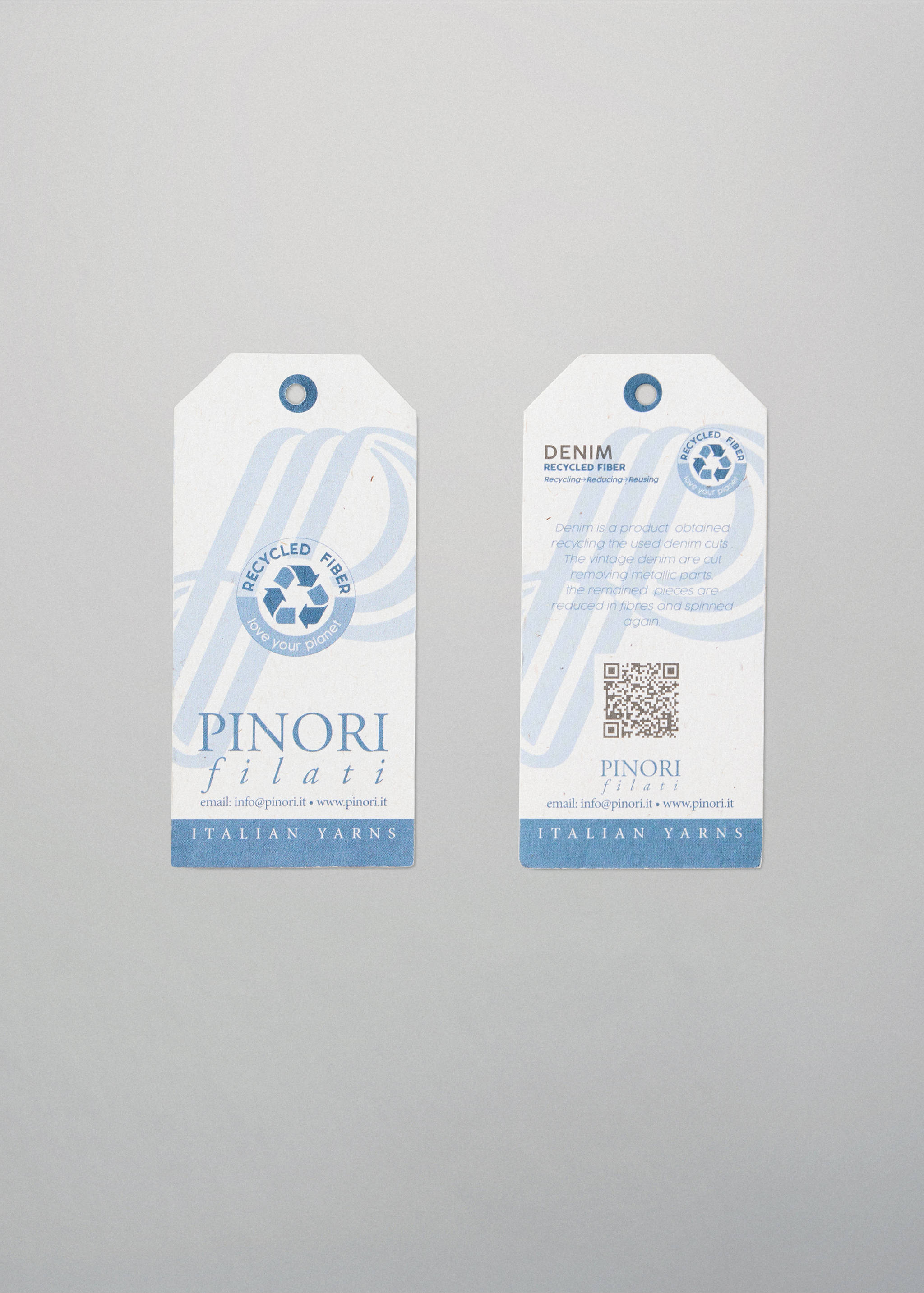 Pinori Filati Italian Yarns product tags on a neutral background., Navy. Ref: 37085841-00.