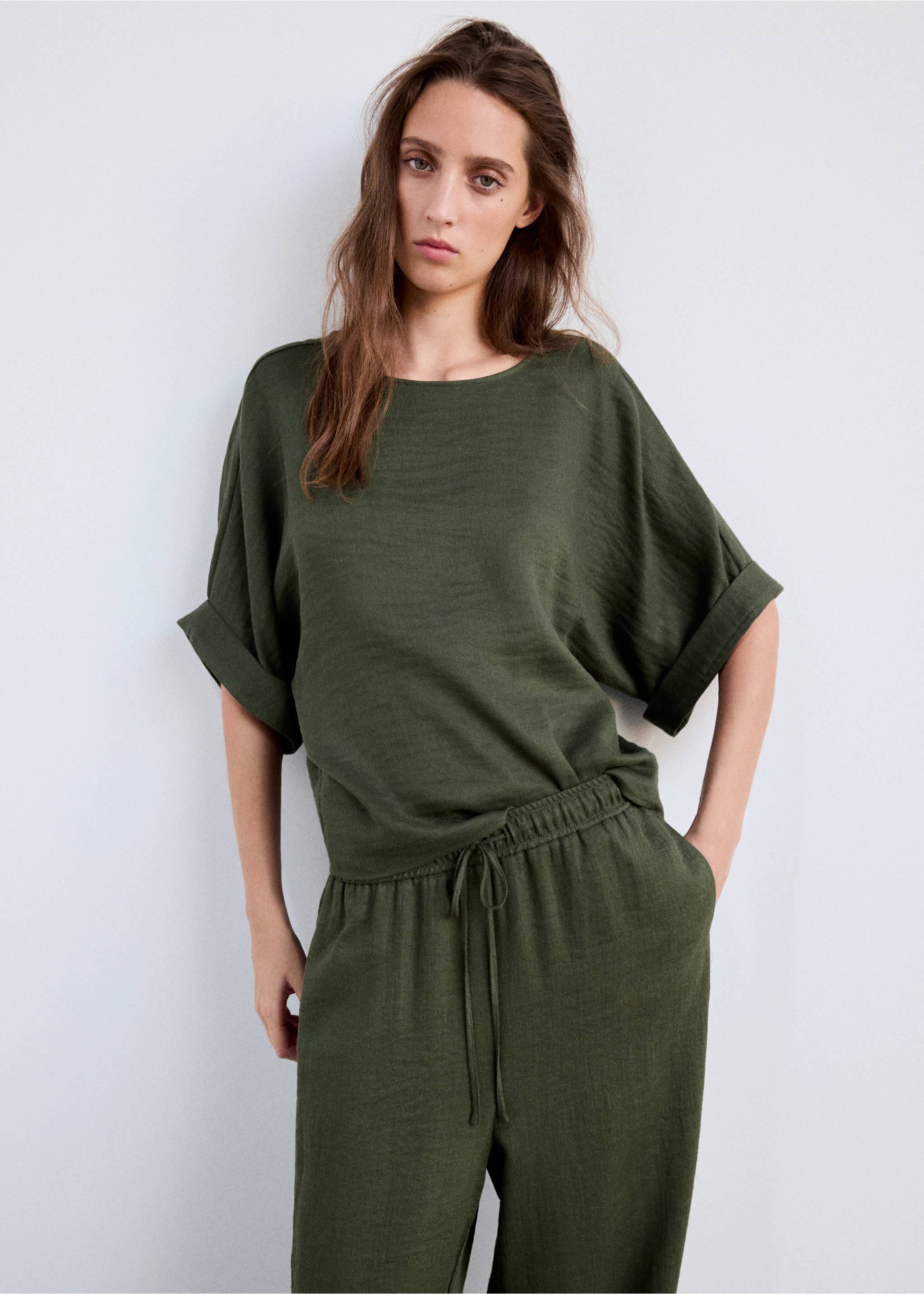 Textured flowy trousers - Details of the article 1, Green. Ref: 37085863-00.