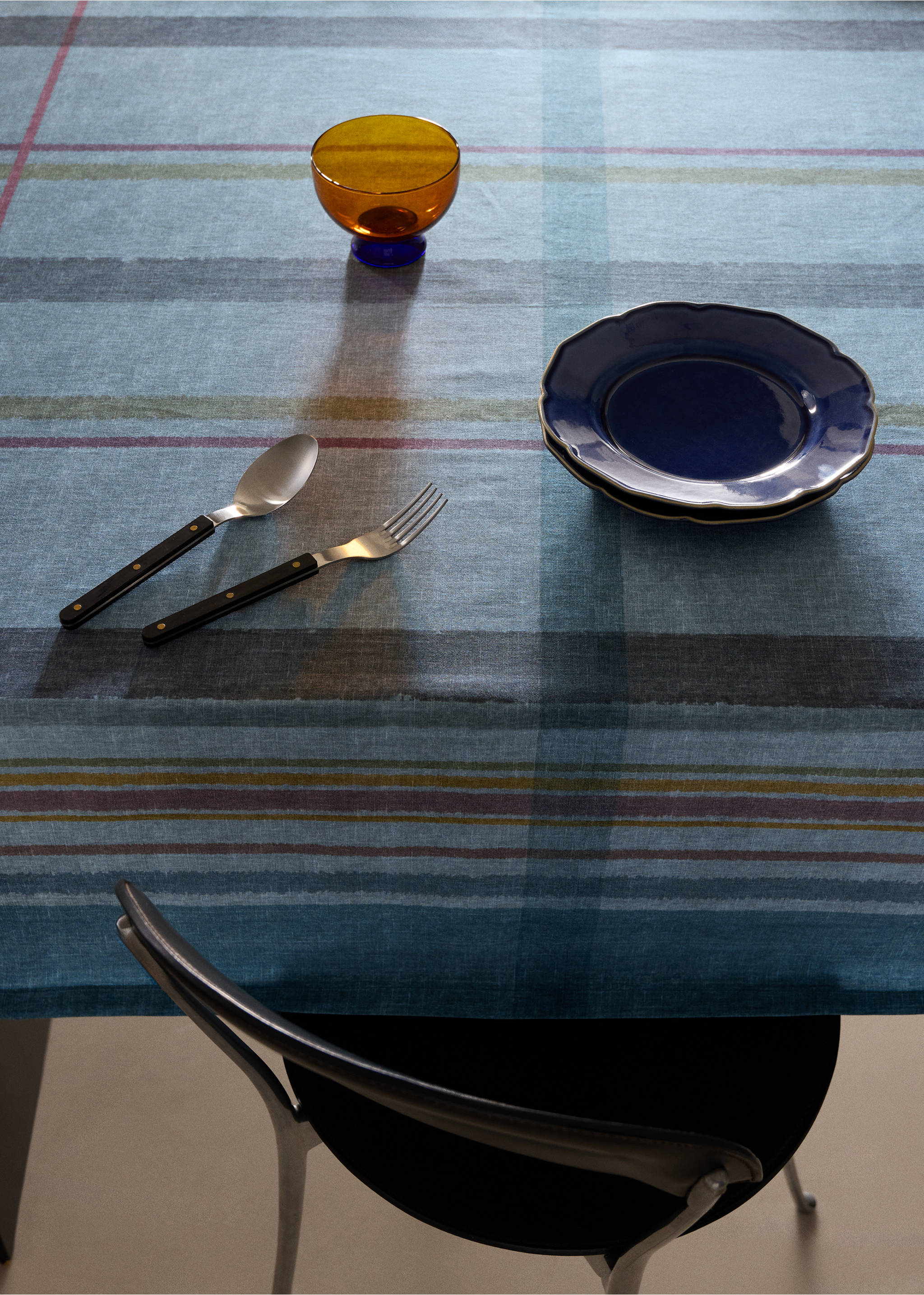Blue checked tablecloth with burgundy and mustard stripes on a set dining table., Petrol Blue. Ref: 37085868-00.