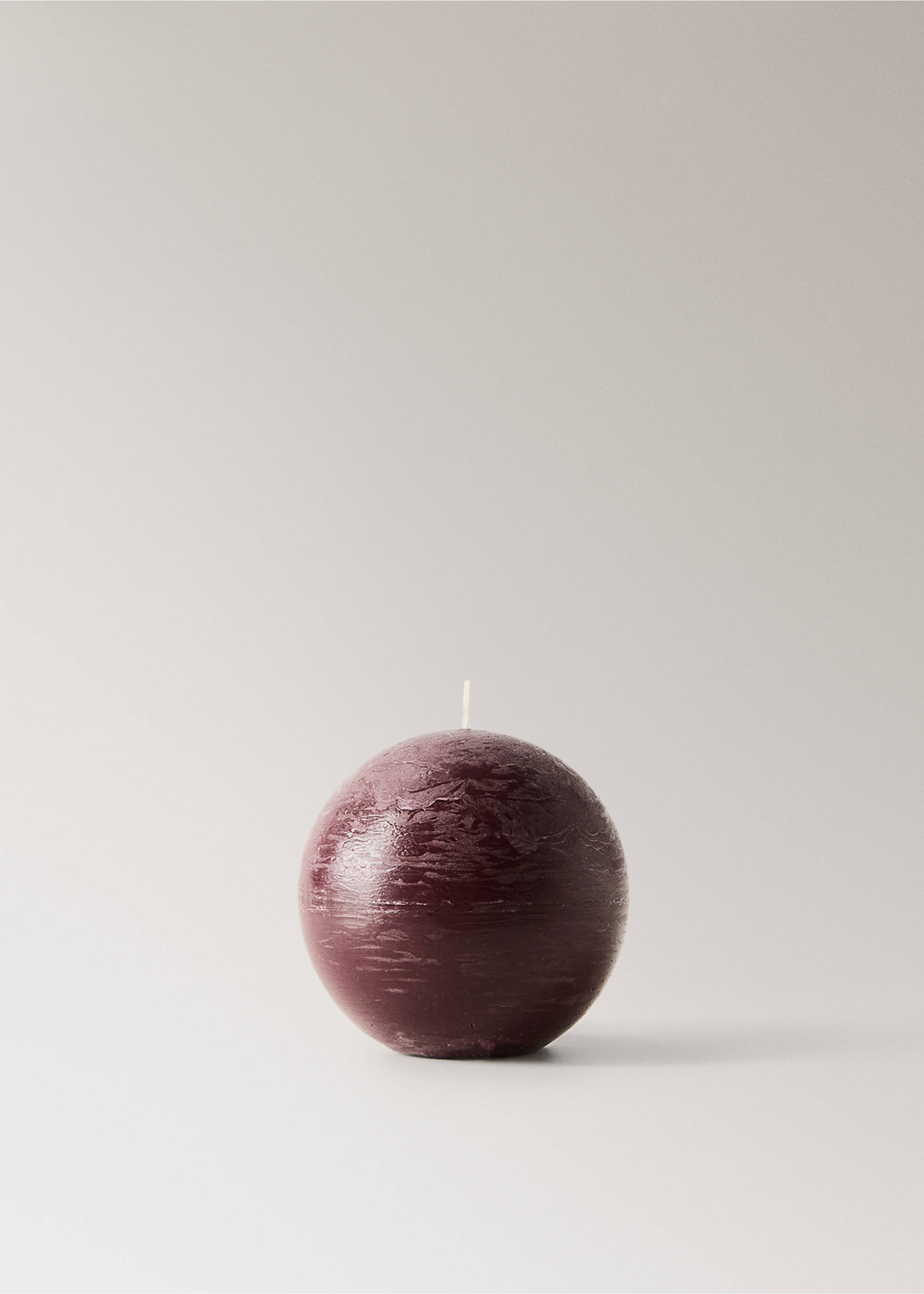 Dark purple spherical candle with a textured rustic surface., Maroon. Ref: 37085881-00.