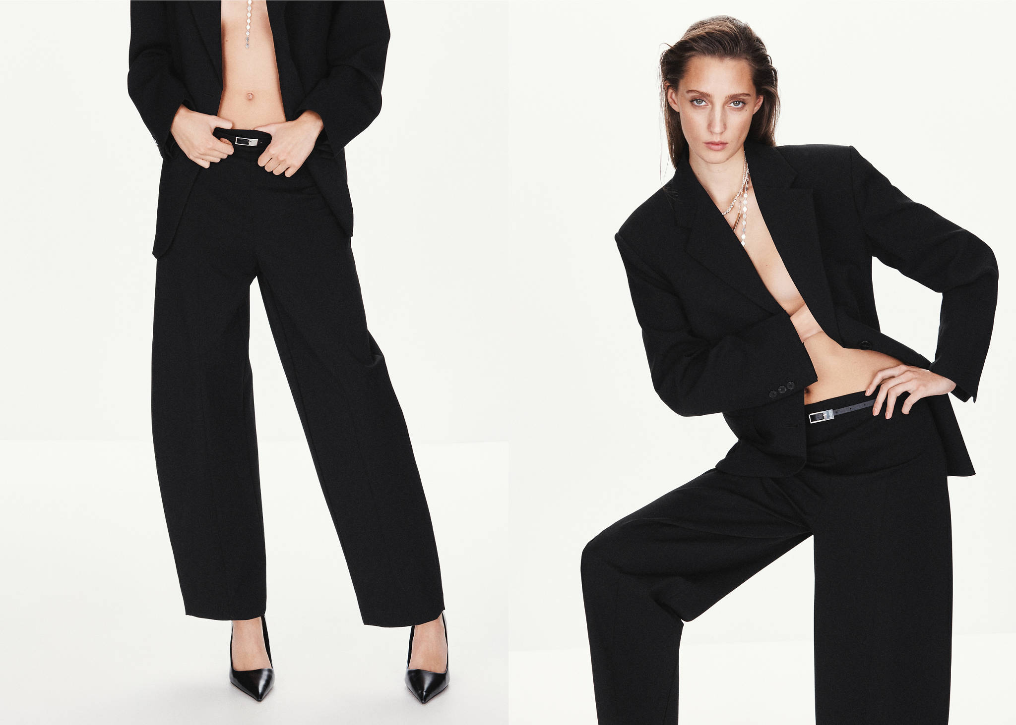 Black wide-leg trousers worn with a matching blazer and slim belt.