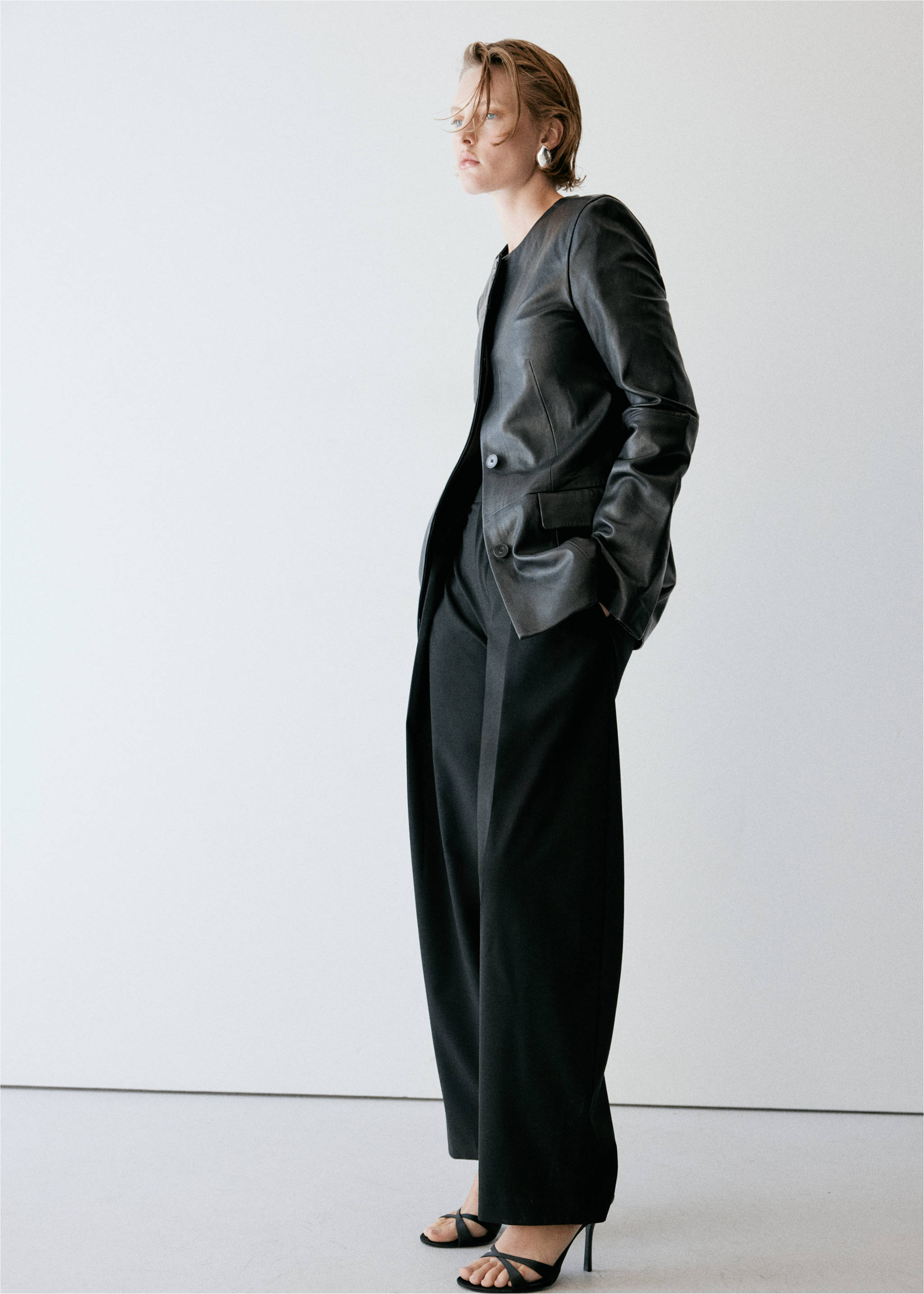 Black wide-leg trousers worn with a black leather jacket., Black. Ref: 37085992-00.