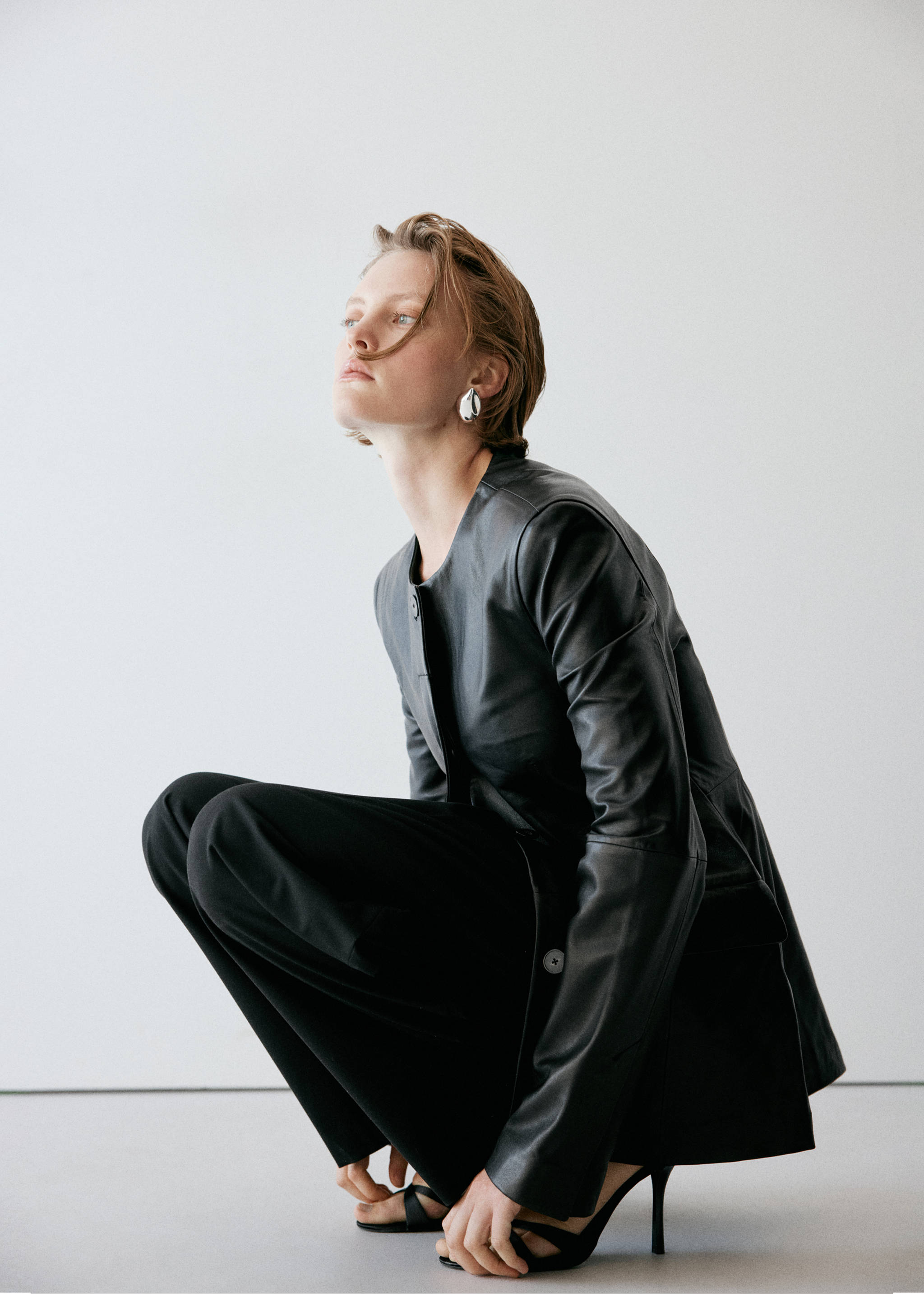Black trousers worn with a black leather jacket and heeled sandals., Black. Ref: 37085992-00.