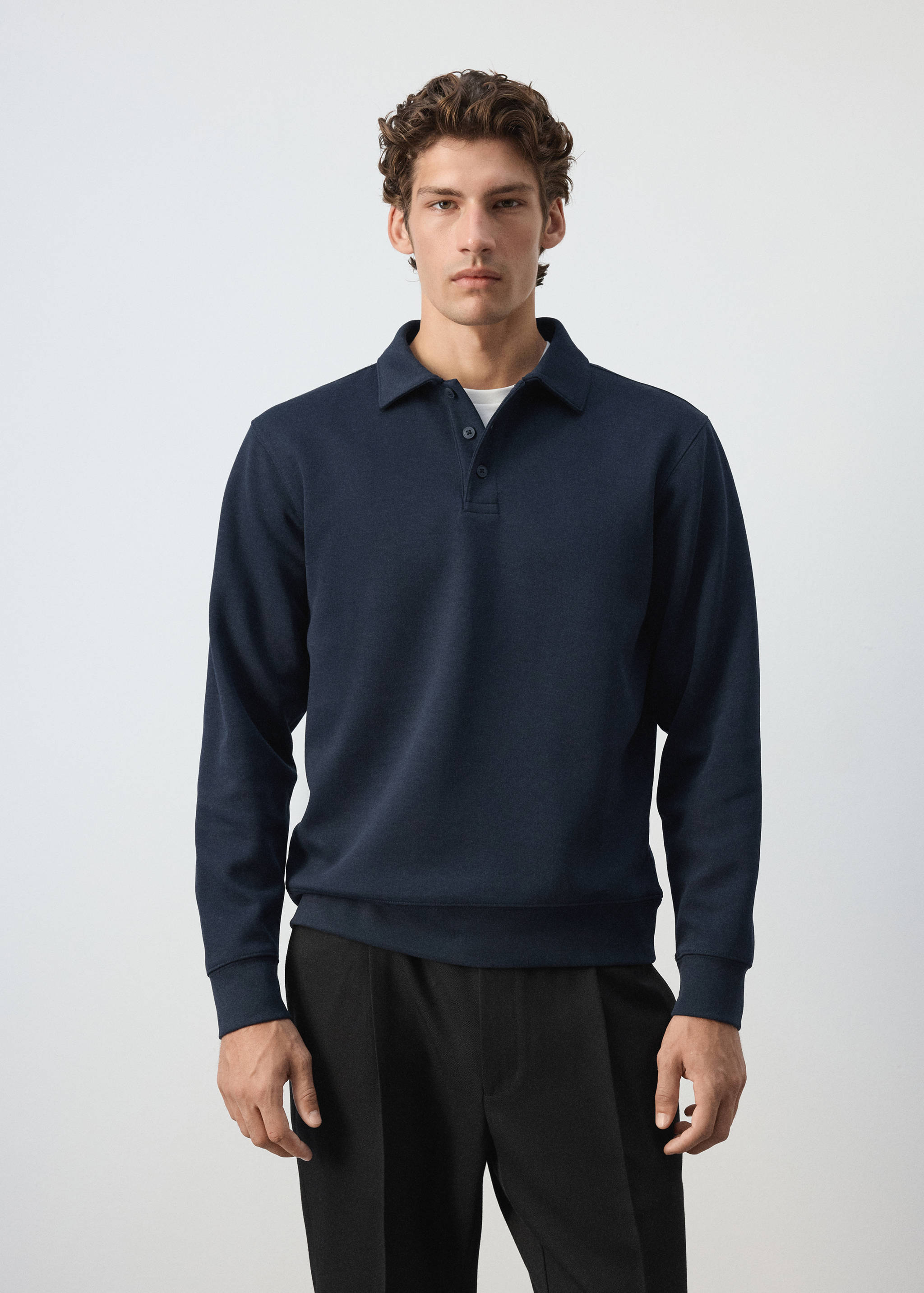 Navy blue polo sweatshirt with a button placket and long sleeves.