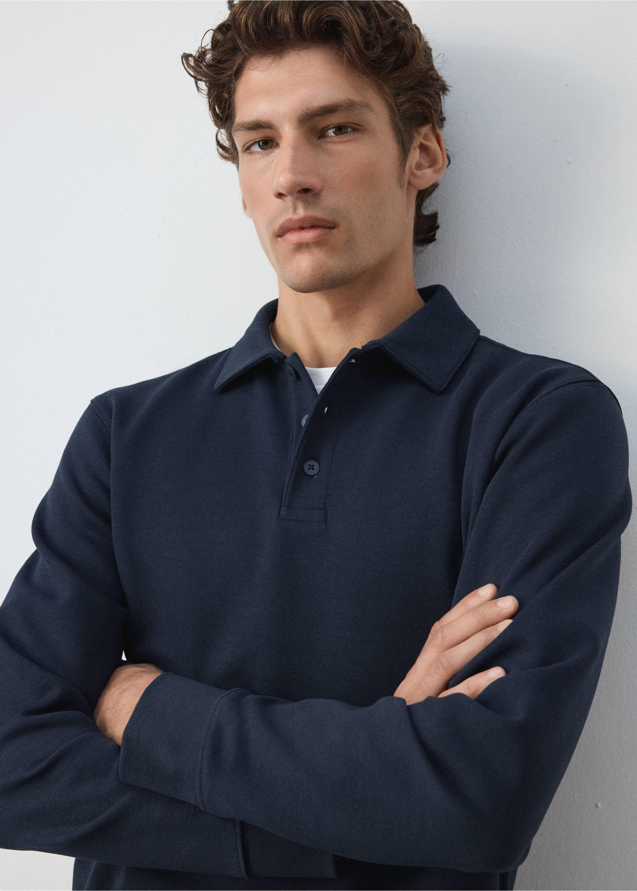 Dark navy blue polo sweatshirt with a buttoned placket and long sleeves., Night Blue. Ref: 37085998-00.