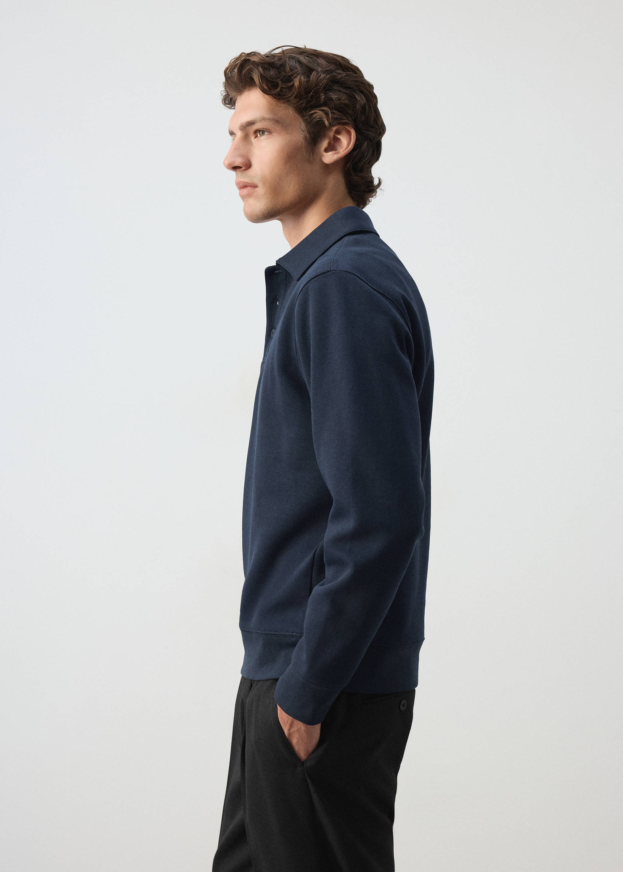 Navy blue collared sweatshirt with button placket.