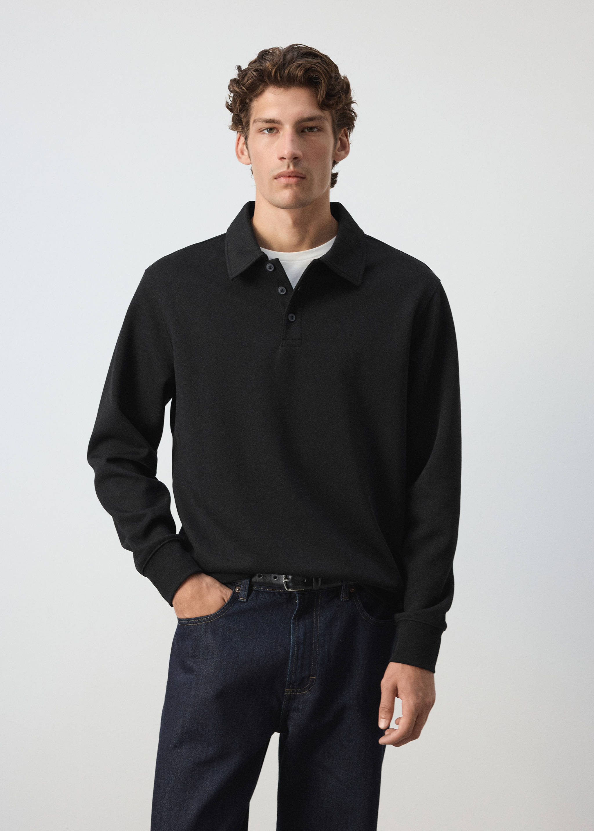 Black long-sleeved polo sweatshirt with a collar and button placket.