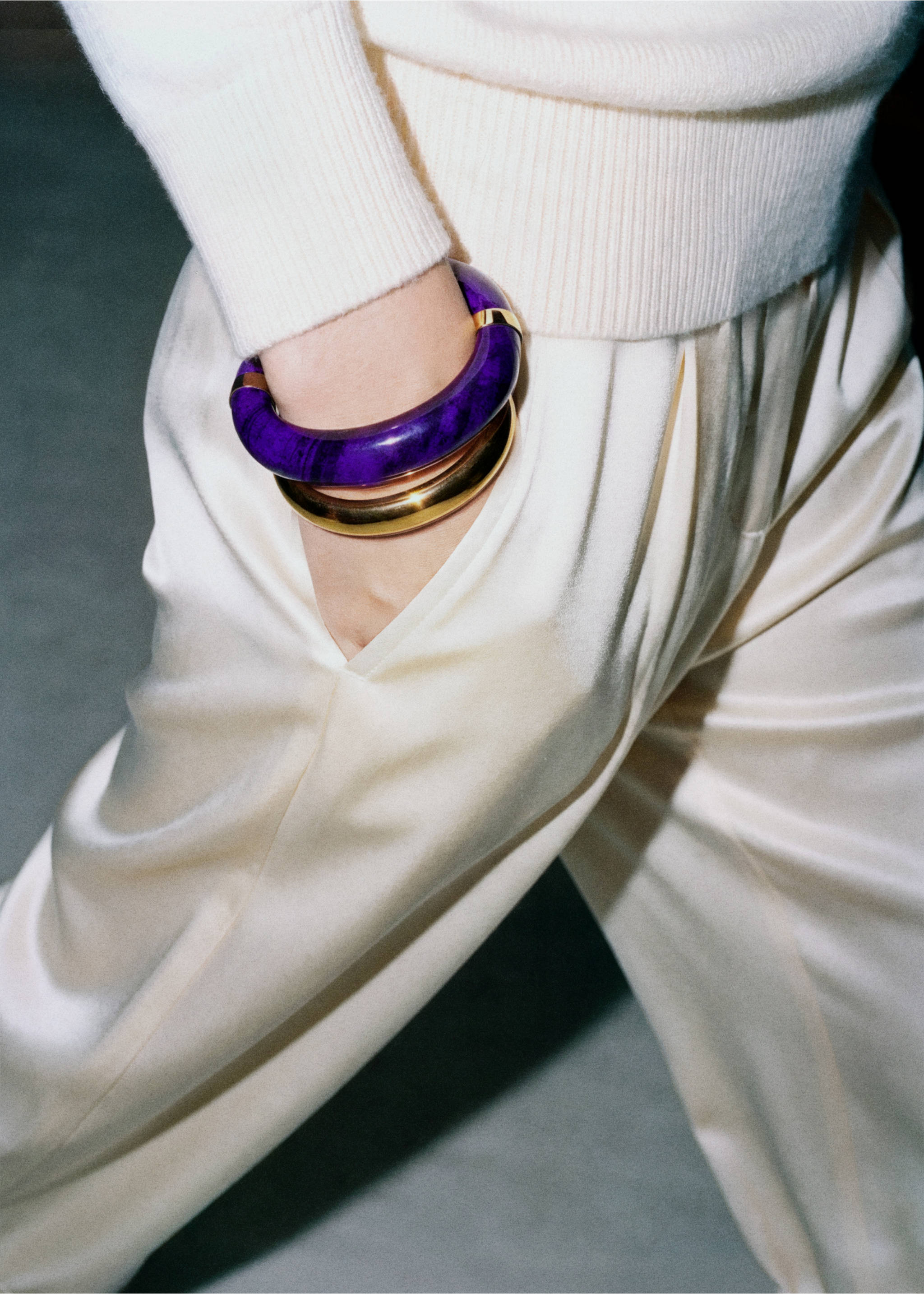 Deep purple patterned and gold-tone metal bangles stacked on a wrist., Gold. Ref: 37086008-00.