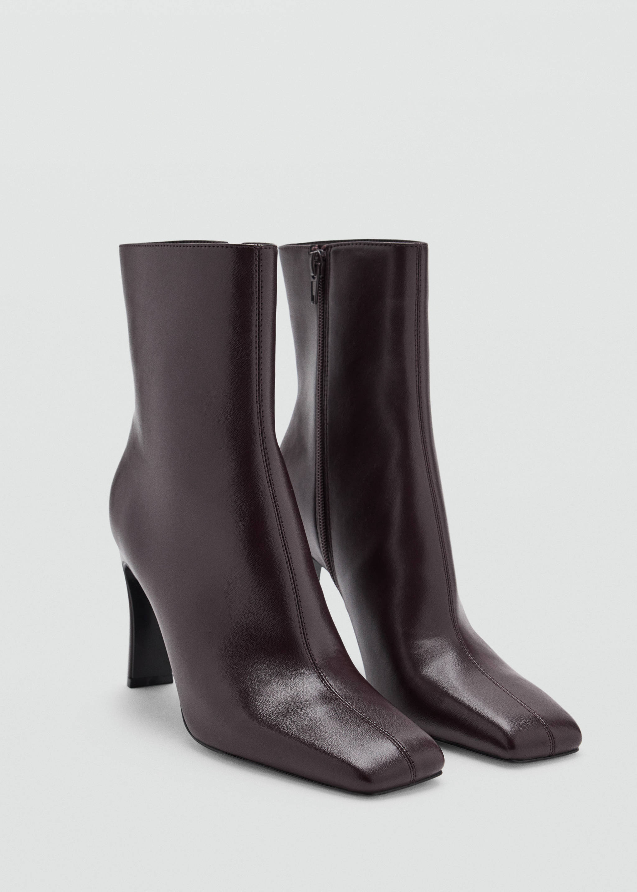 Dark burgundy ankle boots with a squared toe, central seam, and high heel.