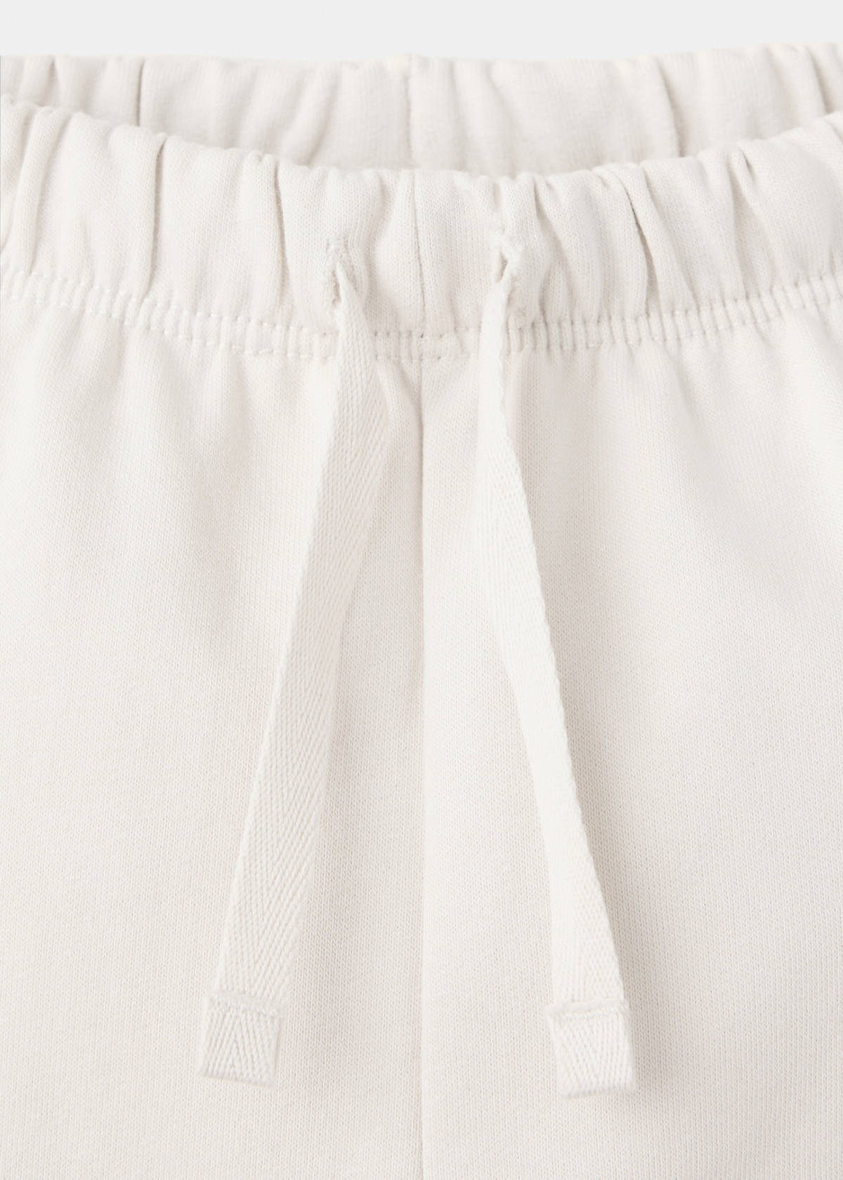 Joggers with embroidered detail pockets — Ecru