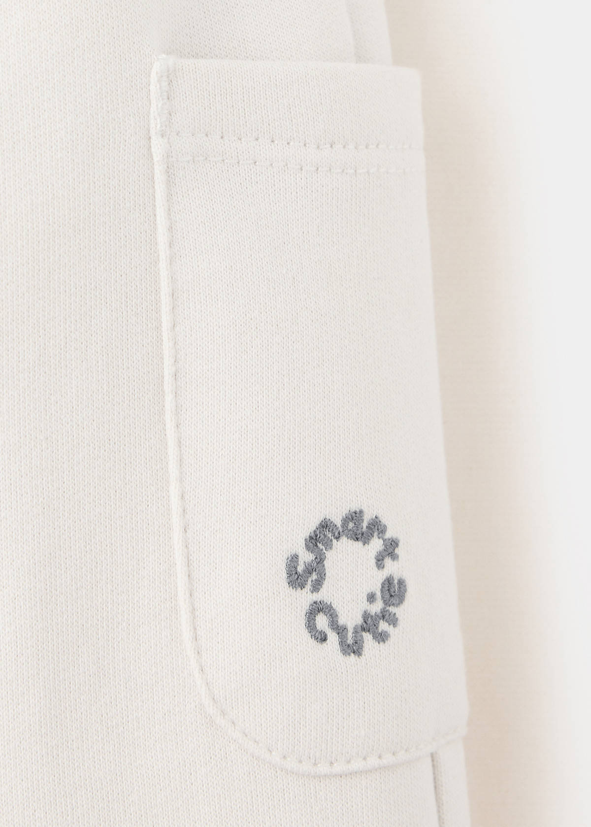 Joggers with embroidered detail pockets — Ecru