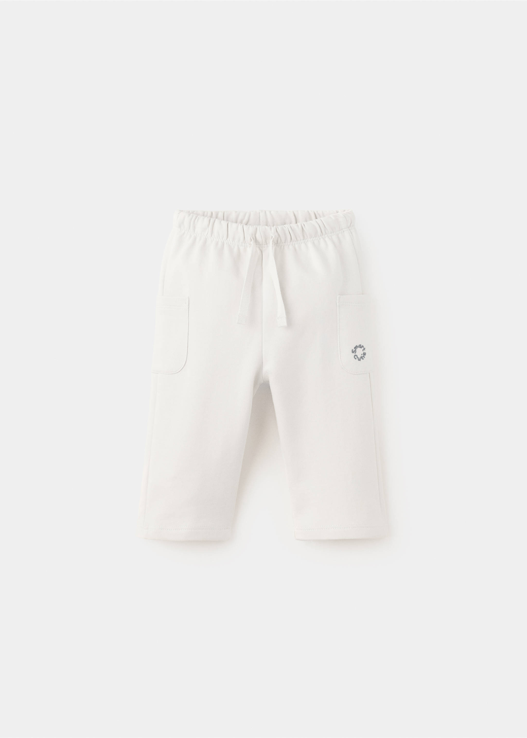 Joggers with embroidered detail pockets - Article without model, Ecru. Ref: 37086339-00.
