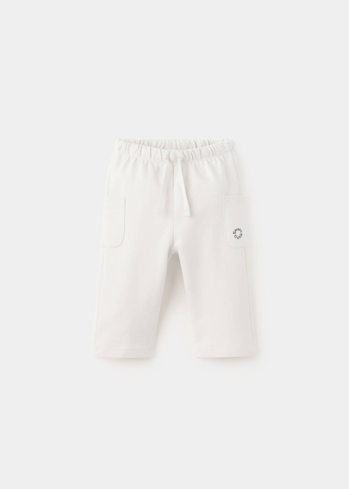 Joggers with embroidered detail pockets — Ecru