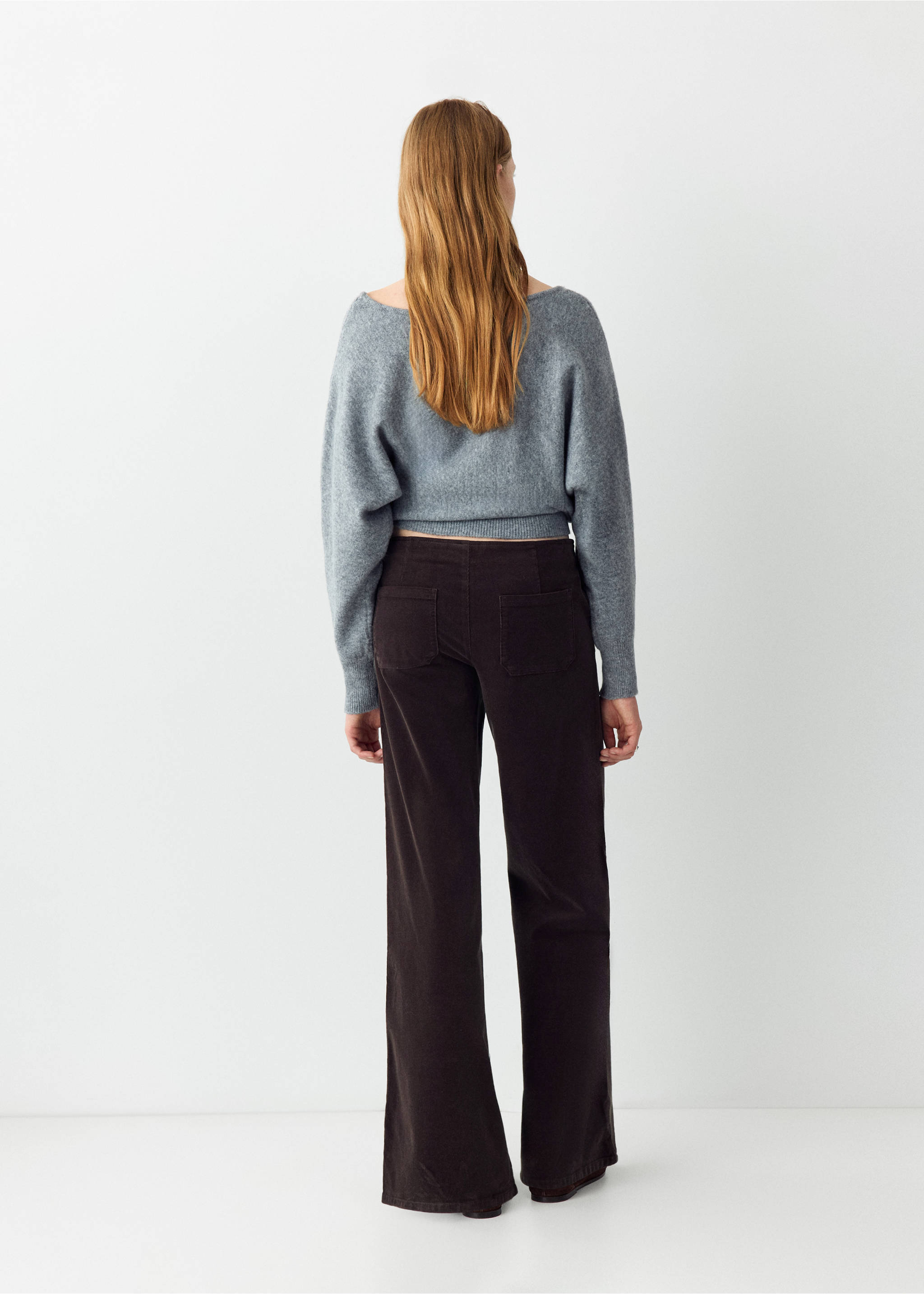 Dark brown trousers, back view, paired with a grey knit top., Chocolate. Ref: 37086723-00.