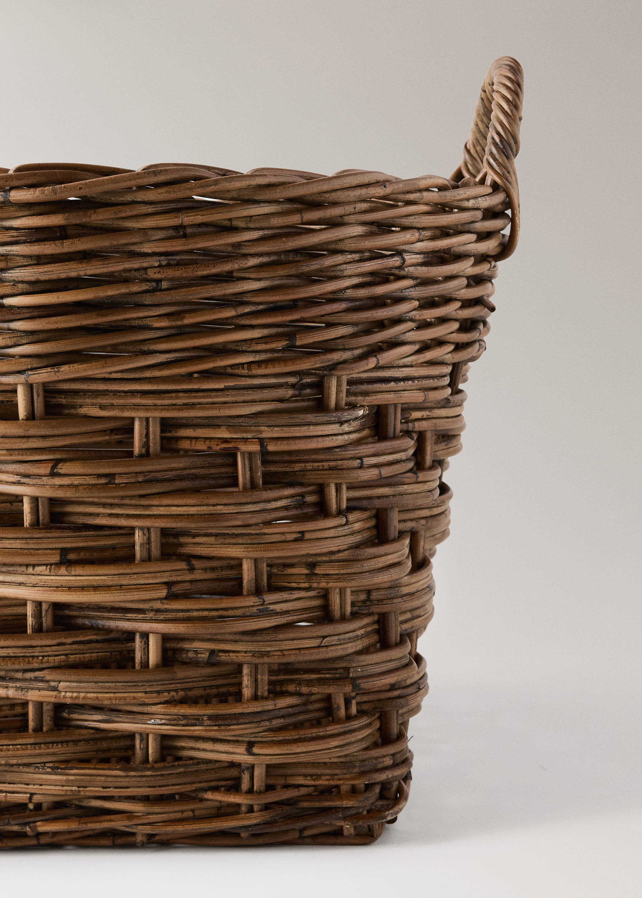 Close-up of a brown woven rattan basket detail.