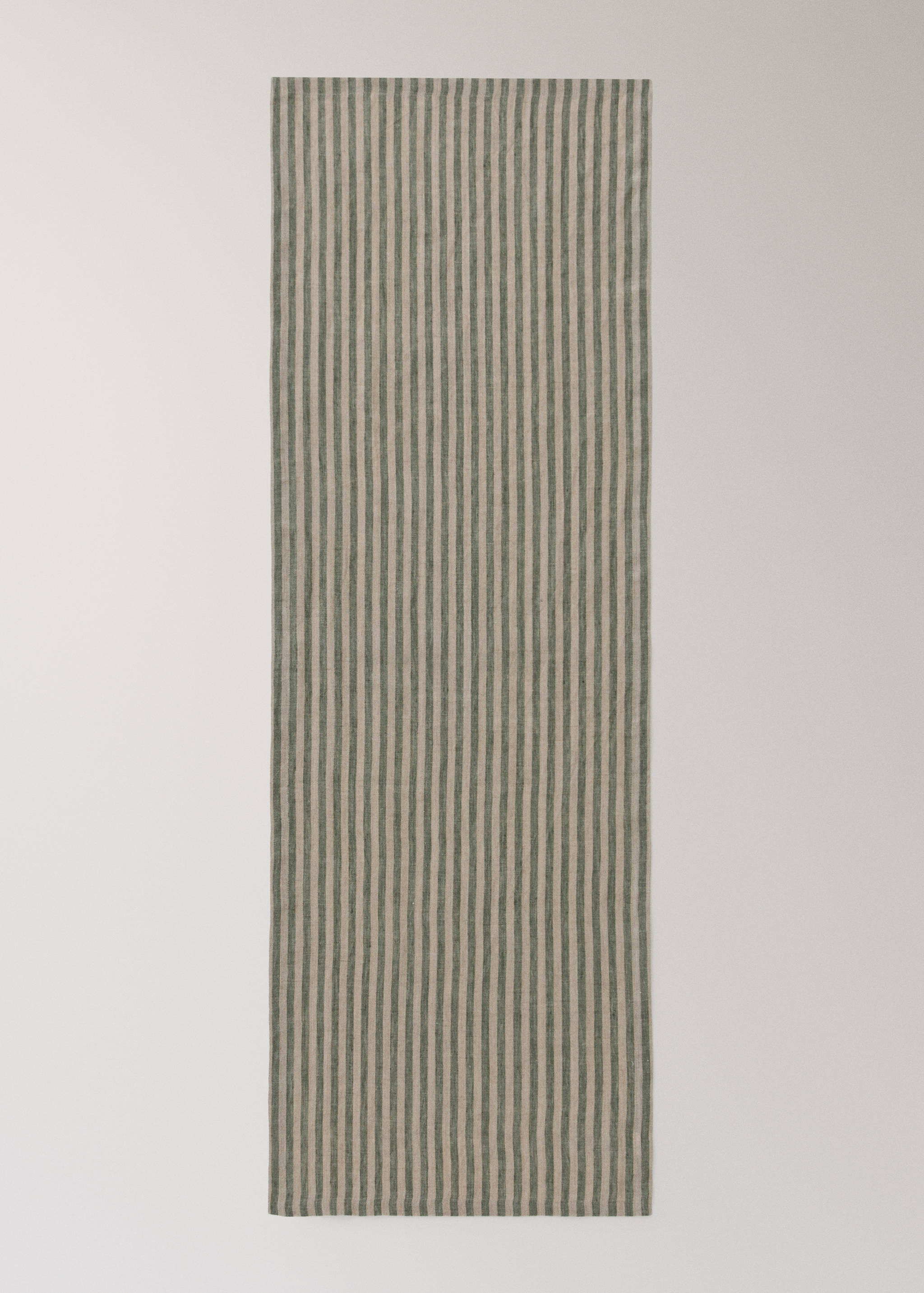 Green and beige striped table runner shown flat.