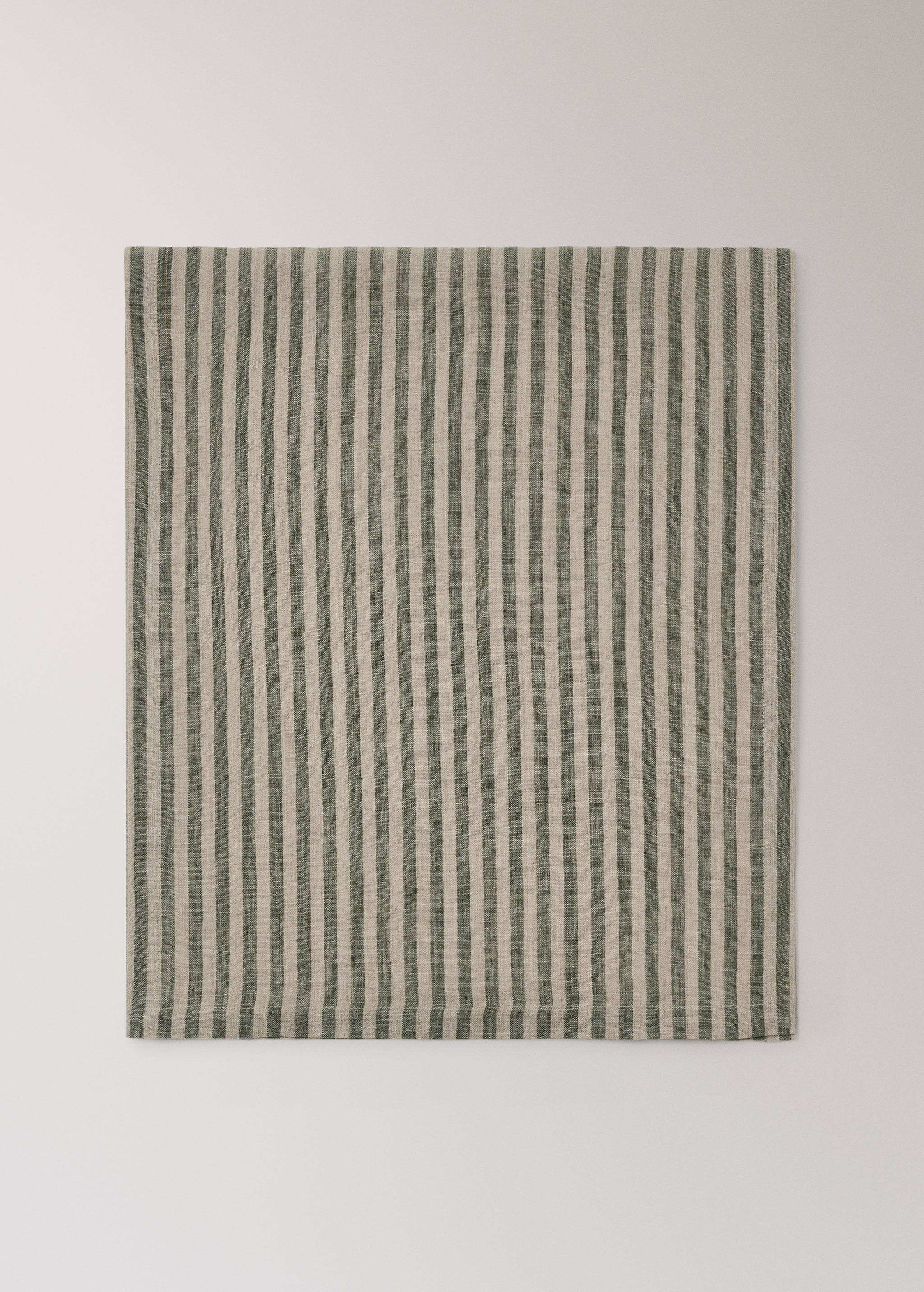 Green and beige striped table runner in textured fabric.