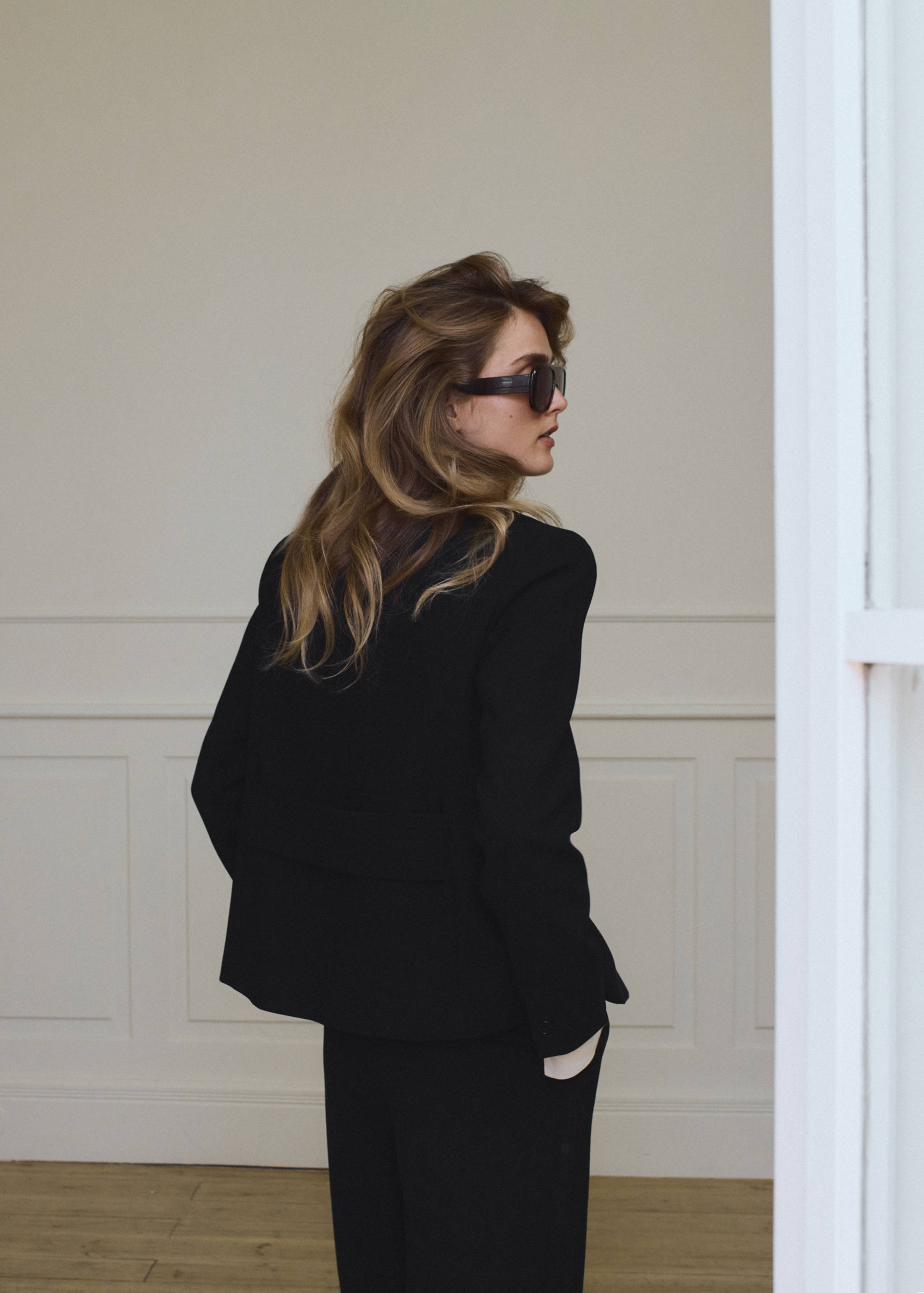 Black blazer, back view.