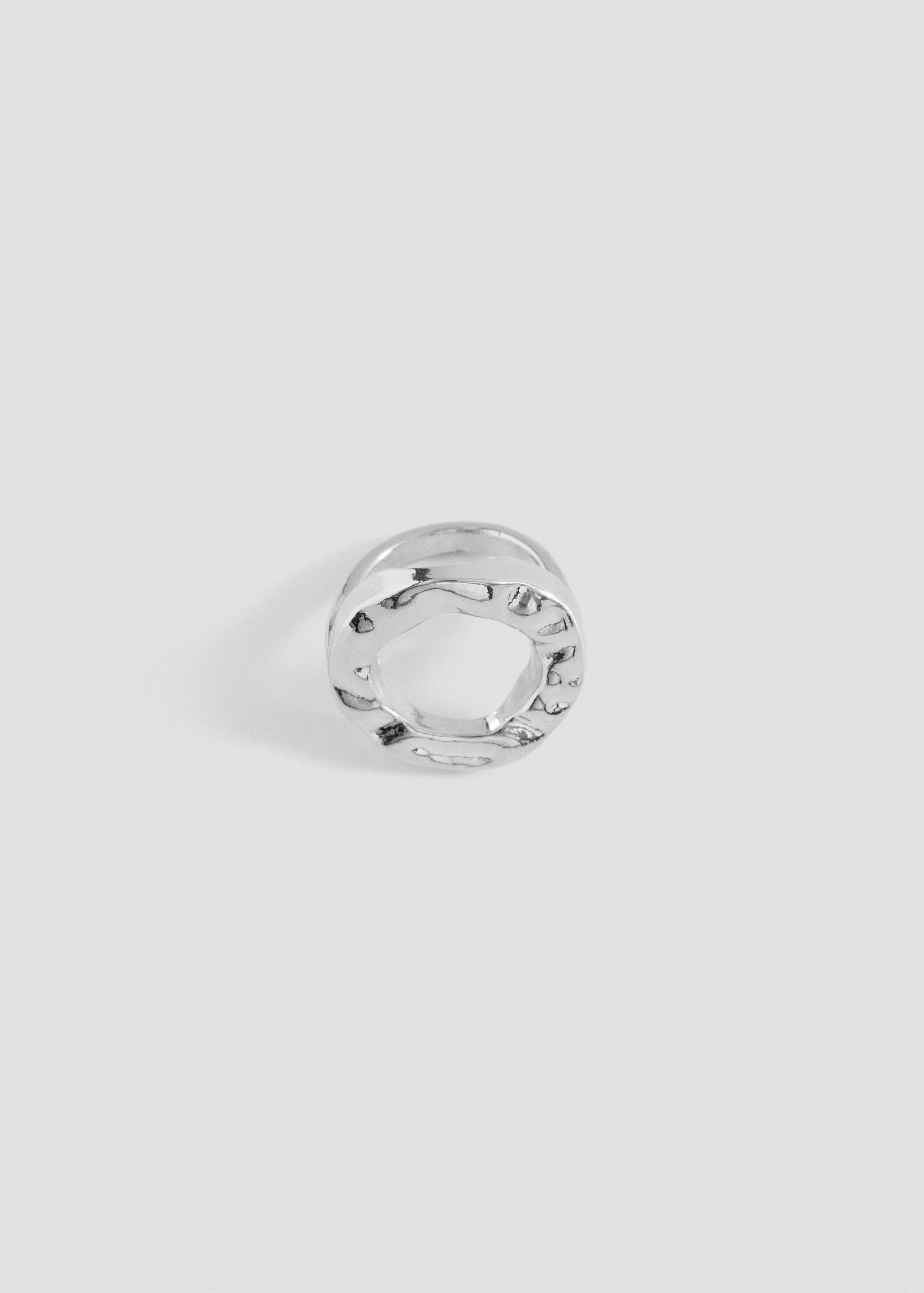 Silver-toned chunky metal ring with an irregular textured finish.