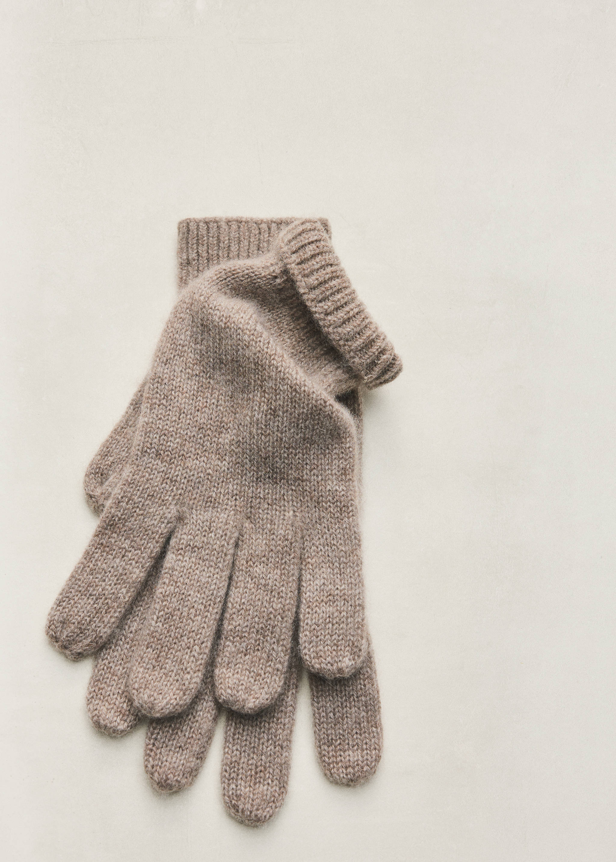 Medium-brown knitted gloves with ribbed fold-over cuffs.